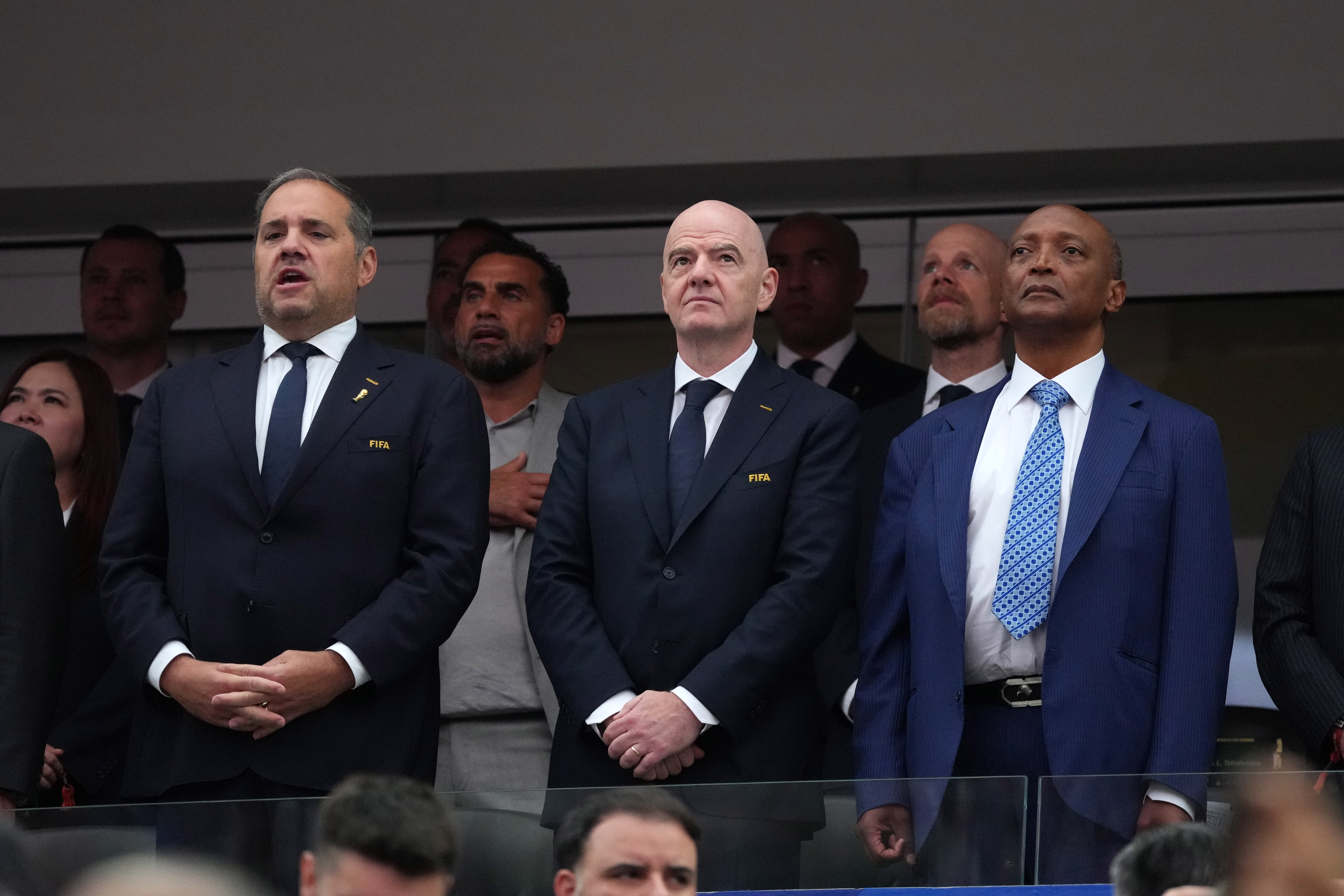 CONCACAF President Victor Montagliani (left), FIFA President Gianni Infantino (centre) and CAF President Patrice Motsepe attend a match.