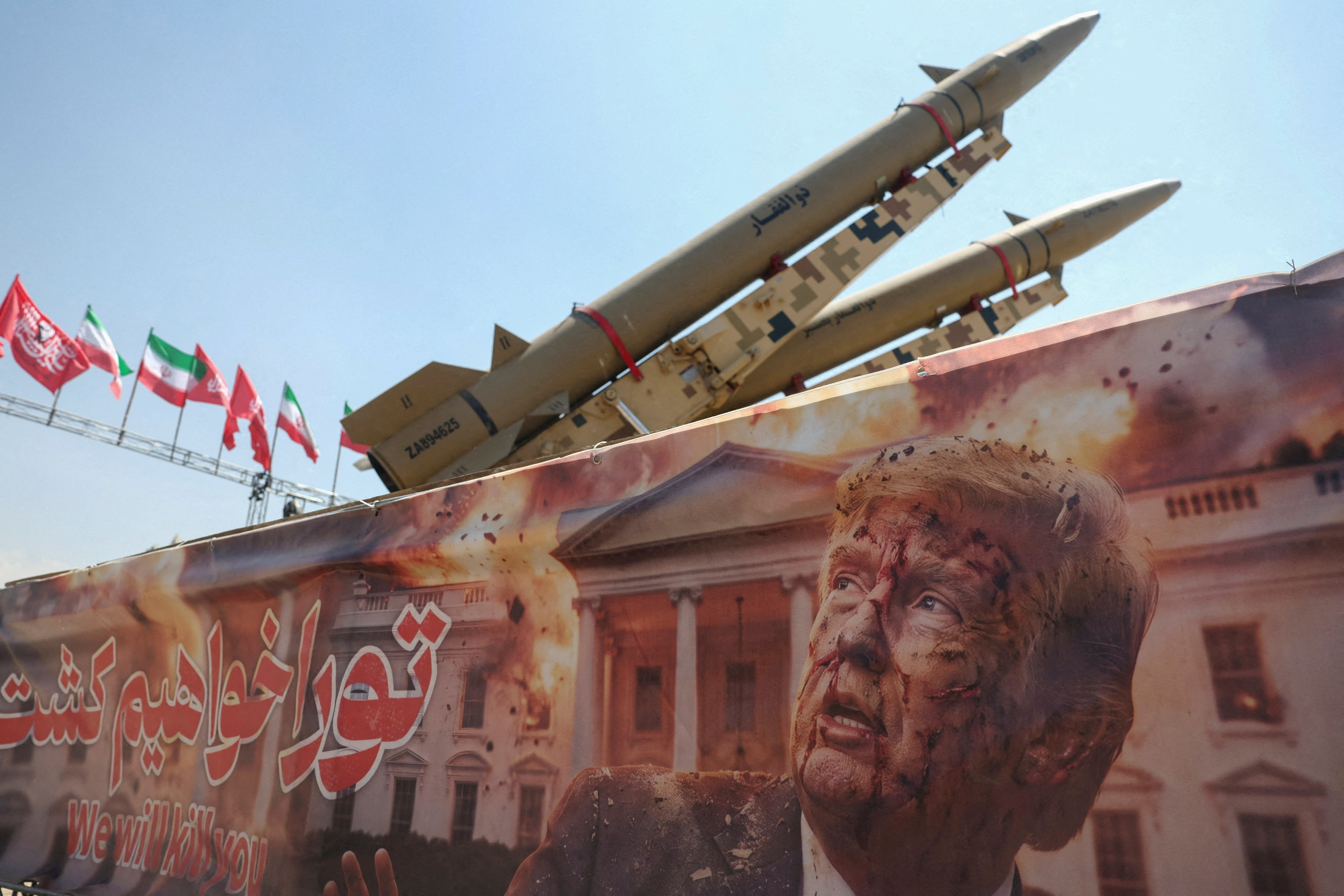A banner with a picture of U.S. President Donald Trump next to an Iranian missile system at Azadi Square in Tehran, Iran, July 30, 2026.