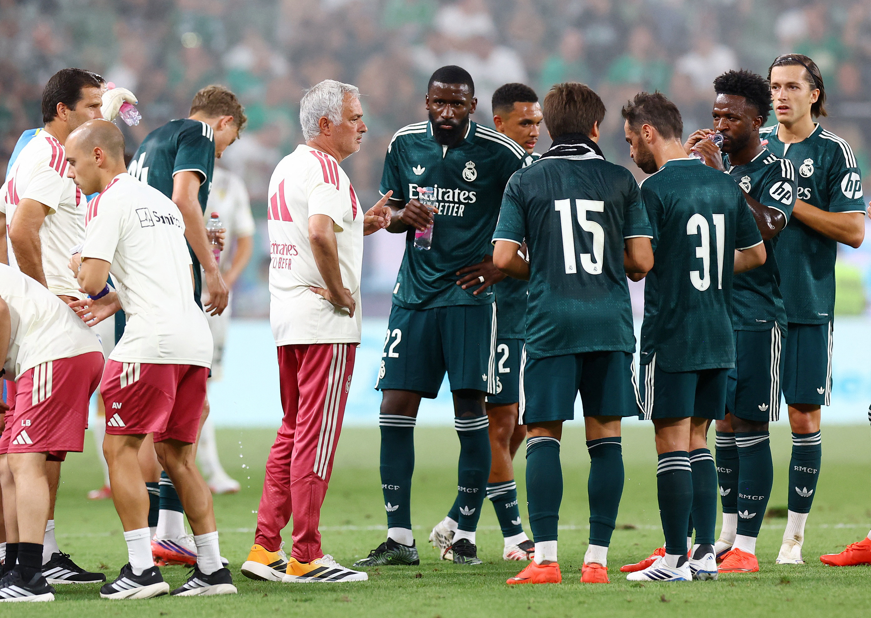 Real Madrid coach Jose Mourinho with the players during a preseason friendly