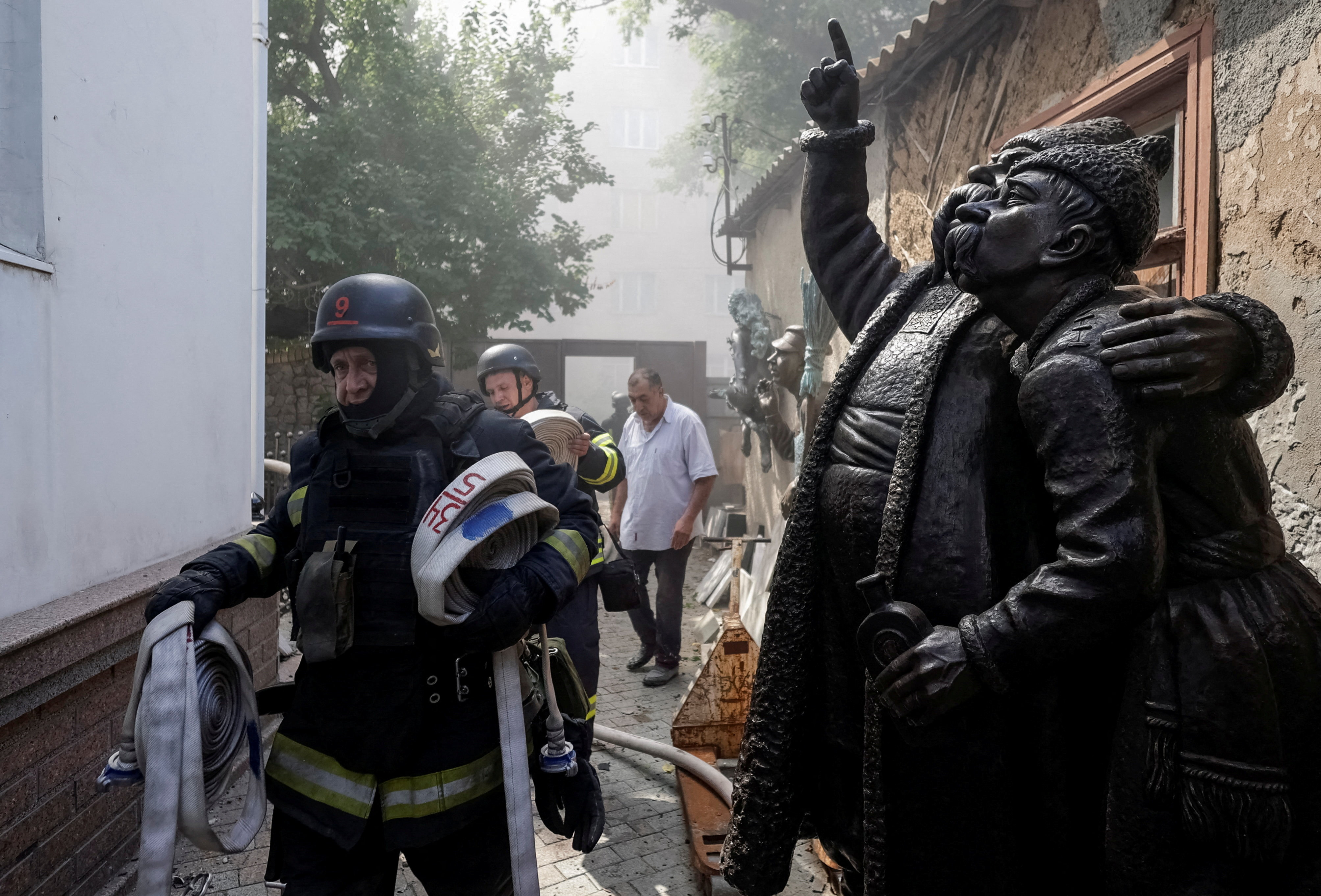 Rescuers work at a site of a local artist's house that was damaged during a Russian drone strike, amid Russia's attack on Ukraine, in Kharkiv, Ukraine August 10, 2026. REUTERS/Sofiia Gatilova TPX IMAGES OF THE DAY