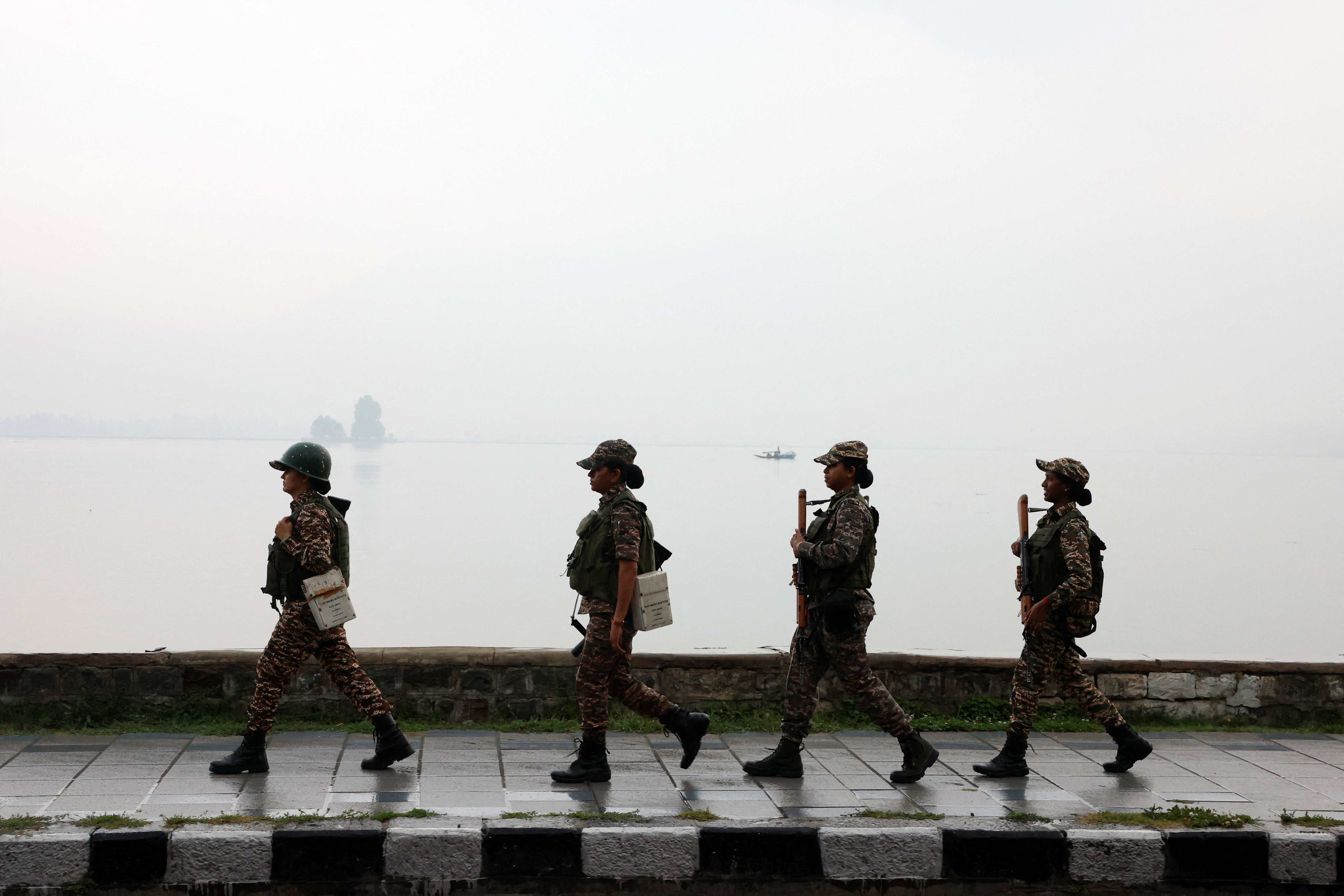 Central Reserve Police Force (CRPF) personnel patrol the banks of Dal Lake during a ‘Tiranga Yatra’ (patriotic march) before India’s Independence Day celebrations, in Srinagar, Indian-administered Kashmir, August 12, 2026