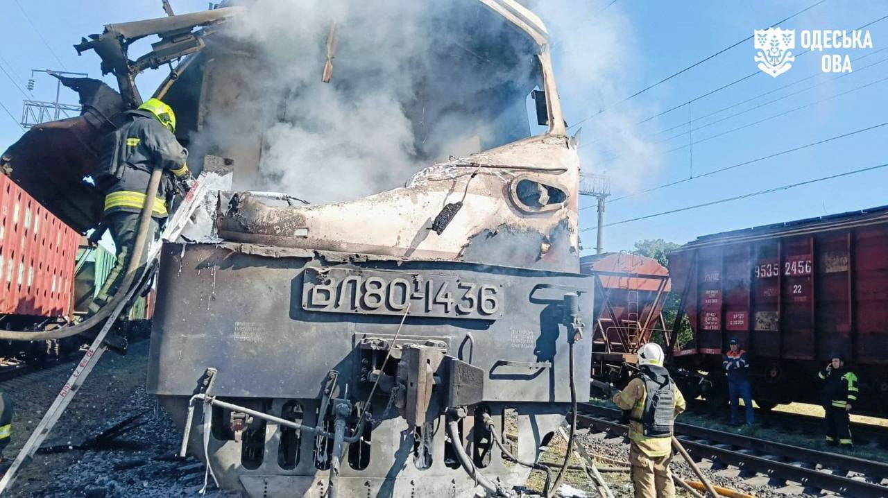 Firefighters extinguish a fire on a train.