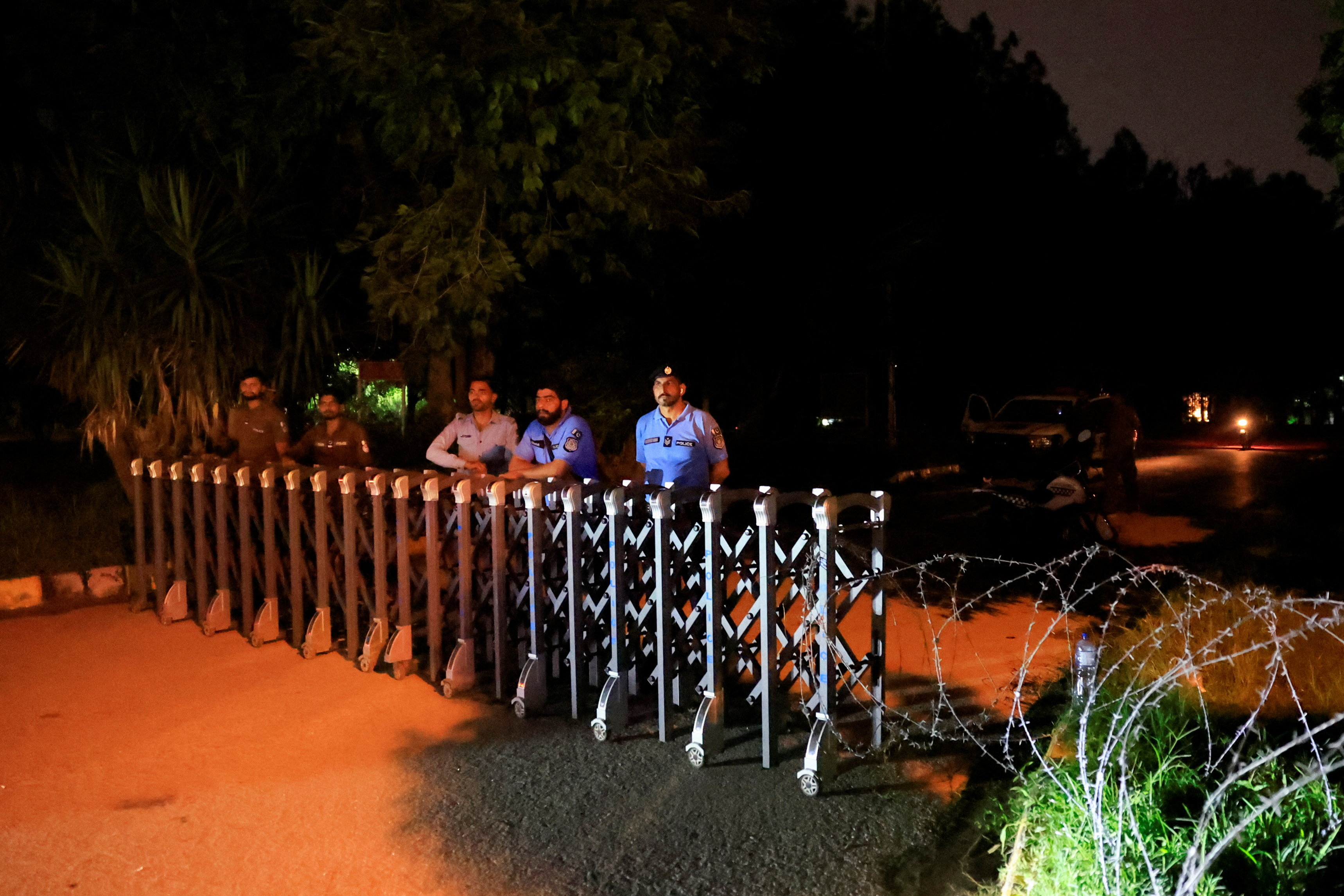Police officers block off access to a road leading to Shifa International Hospital after the Supreme Court ordered authorities to move jailed former Pakistani Prime Minister Imran Khan to the hospital, in Islamabad, Pakistan, August 21, 2026. REUTERS/Akhtar Soomro
