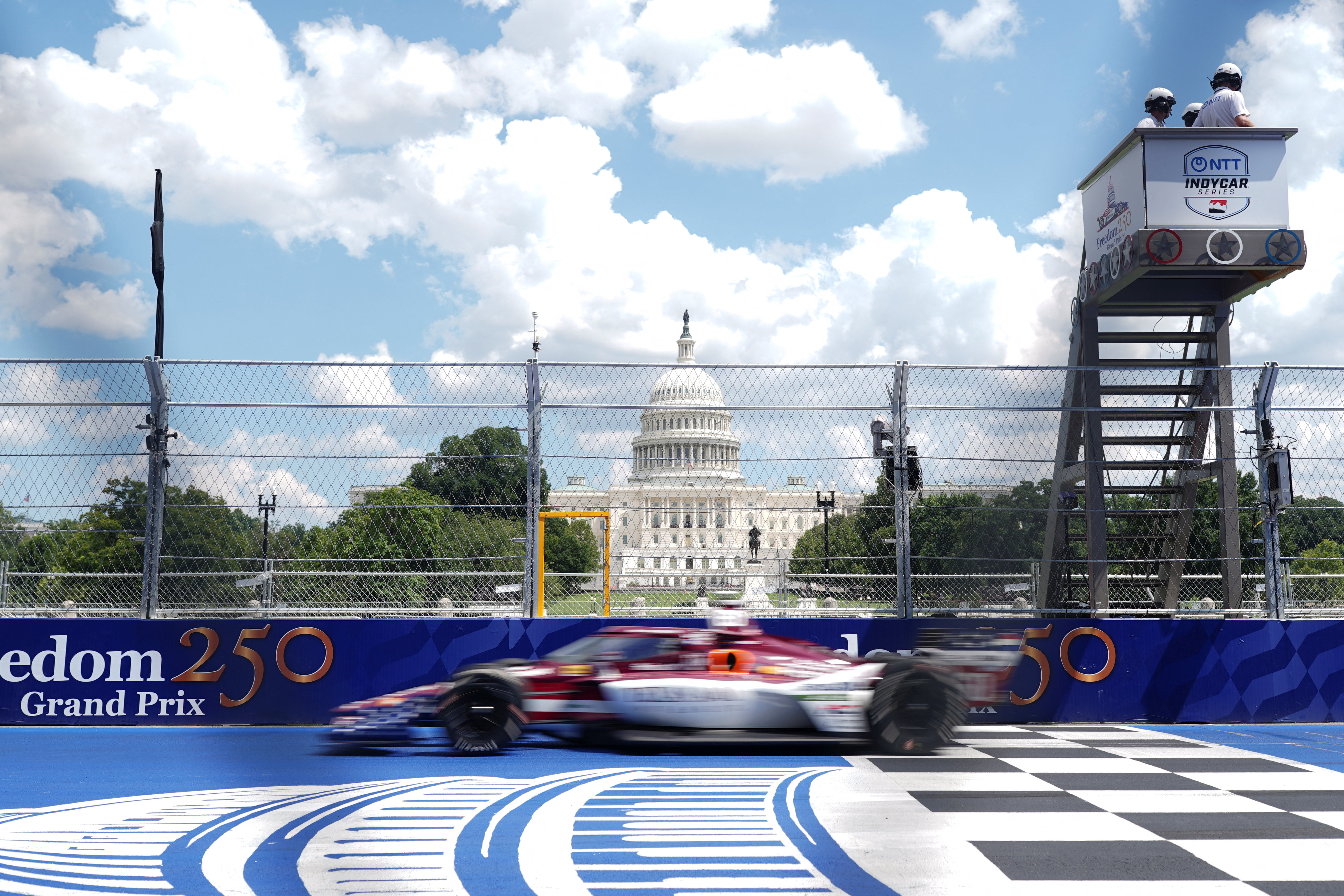 A driver passes in front of the U.S. Capitol during the Freedom 250 Grand Prix IndyCar Series race in Washington, D.C., U.S., August 23, 2026. REUTERS/Nathan Howard
