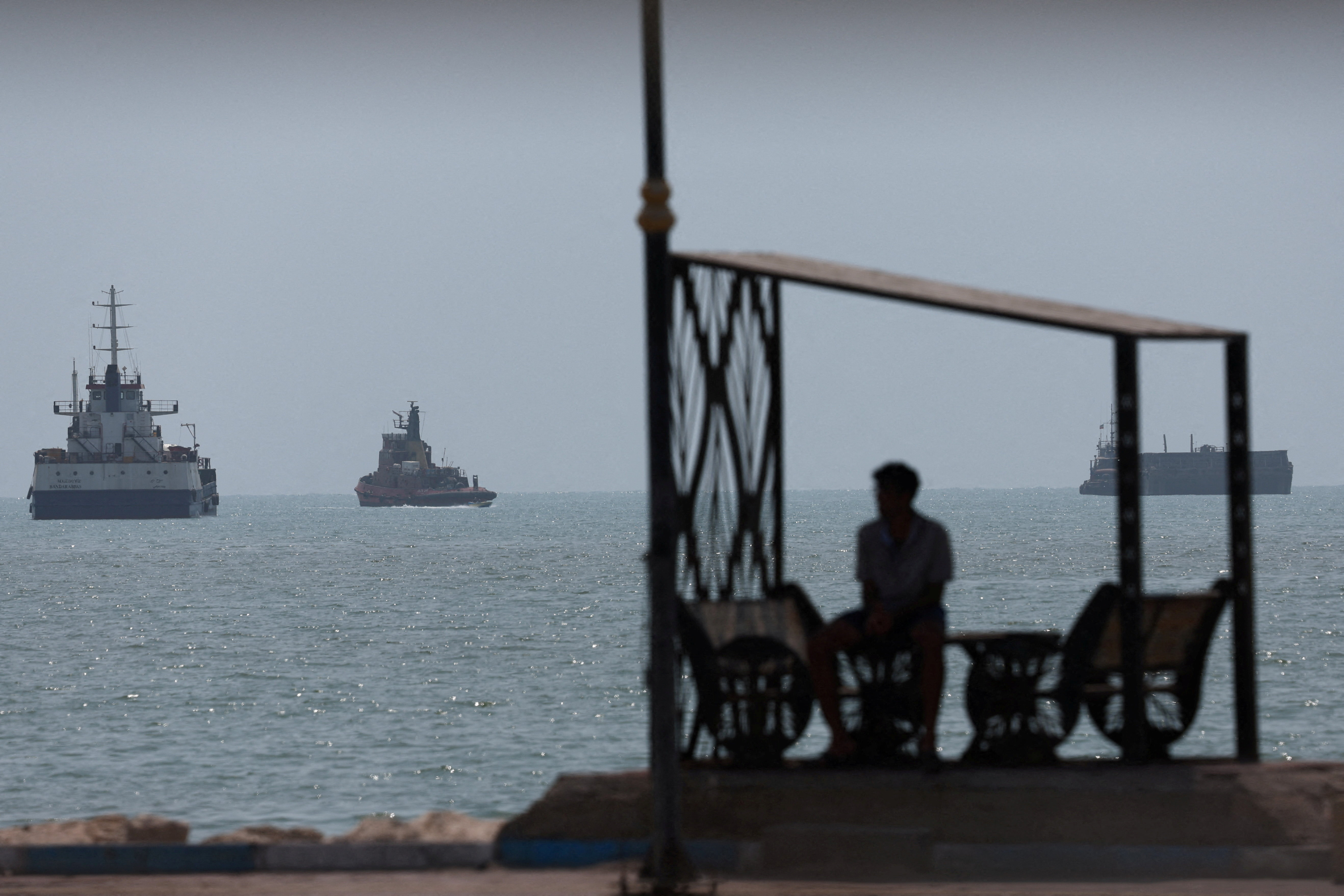 Vessels in the Strait of Hormuz are visible near the beach of Bandar Abbas, Iran, August 28, 2026. [Majid Asgaripour/WANA via Reuters]