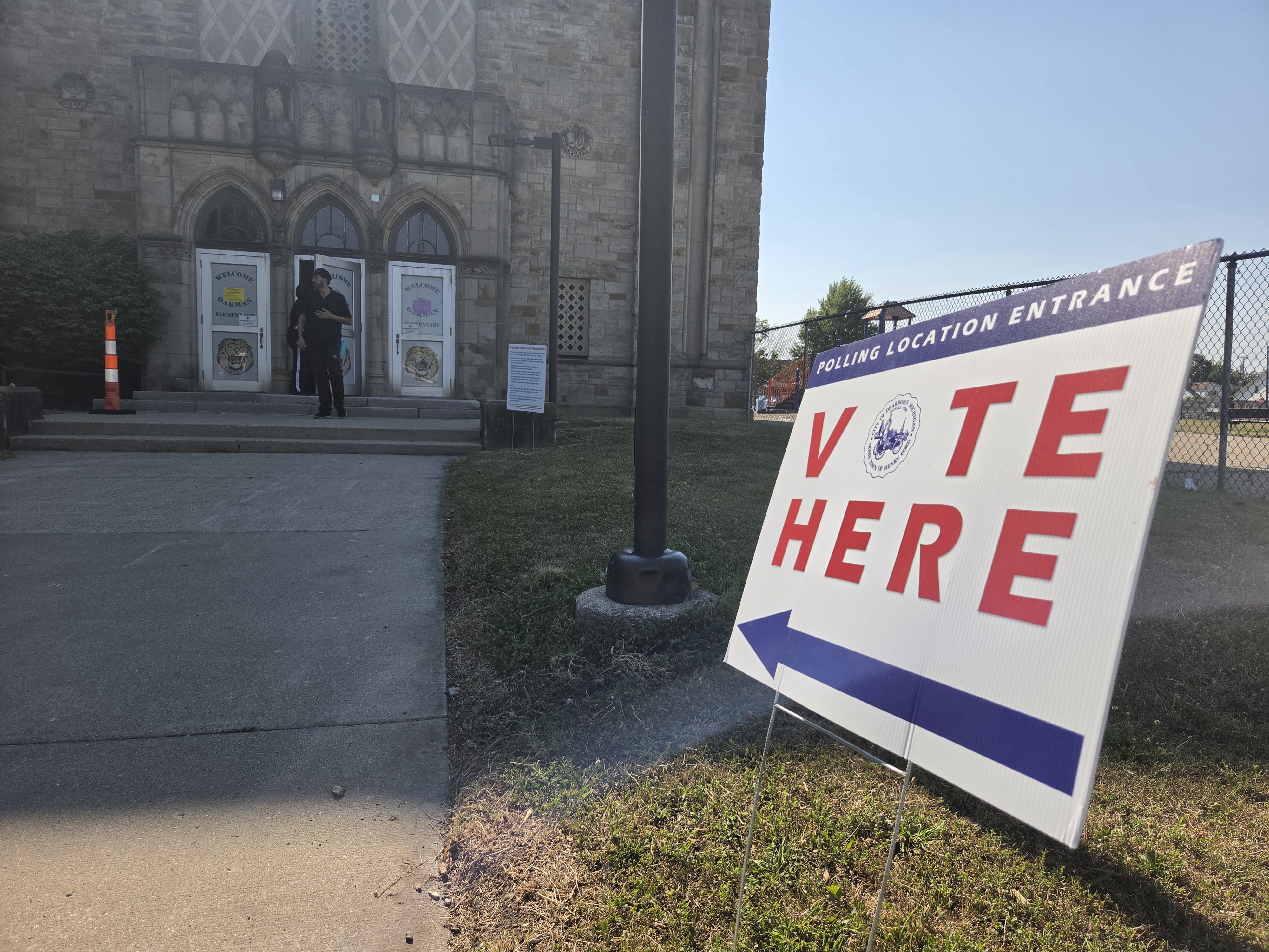 A sign advertises a polling station in Dearborn, Michigan, on election day, August 4