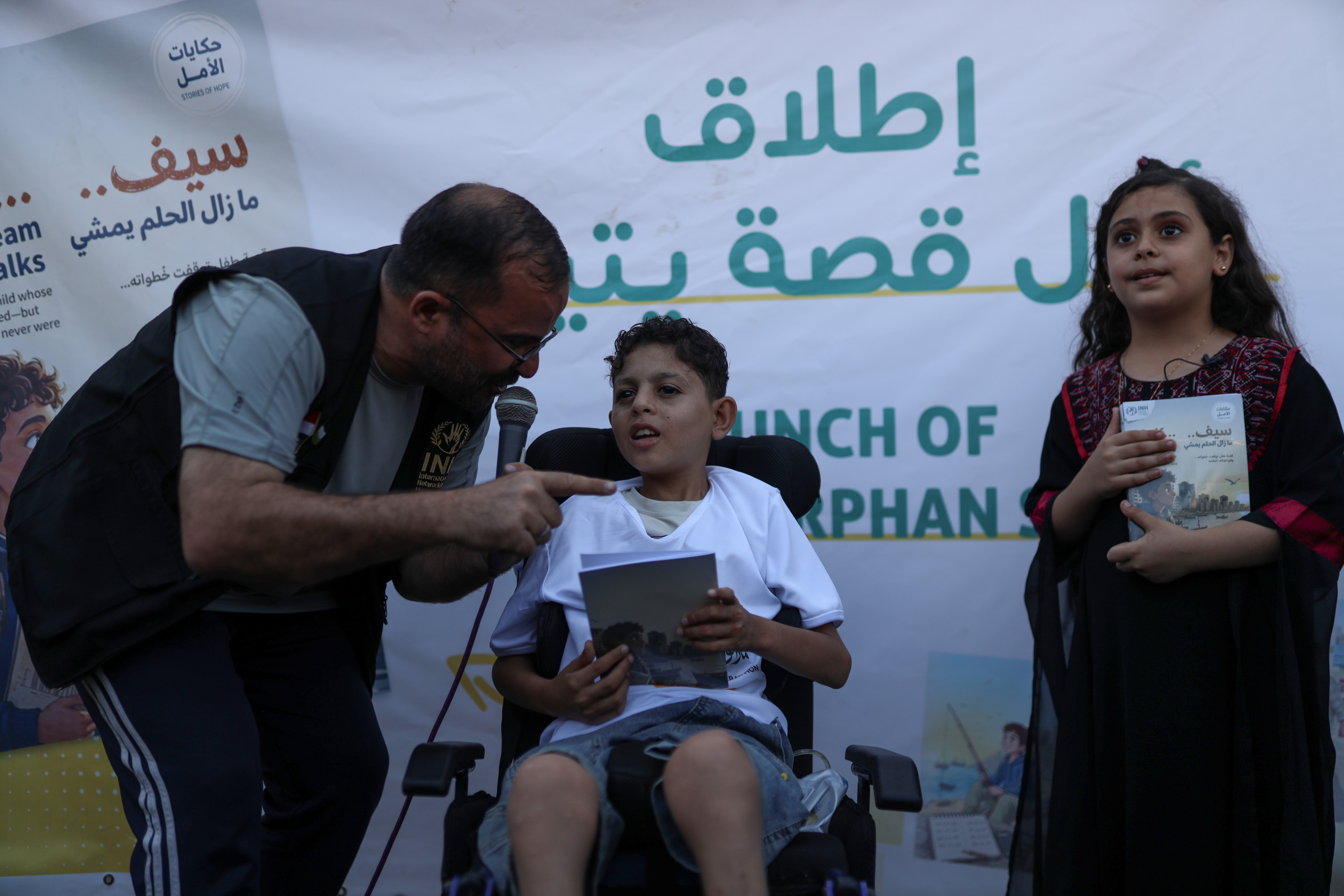 Organisers honour orphaned children who participated and won in the marathon[Abdelhakim Abu Riash/ Al Jazeera] 