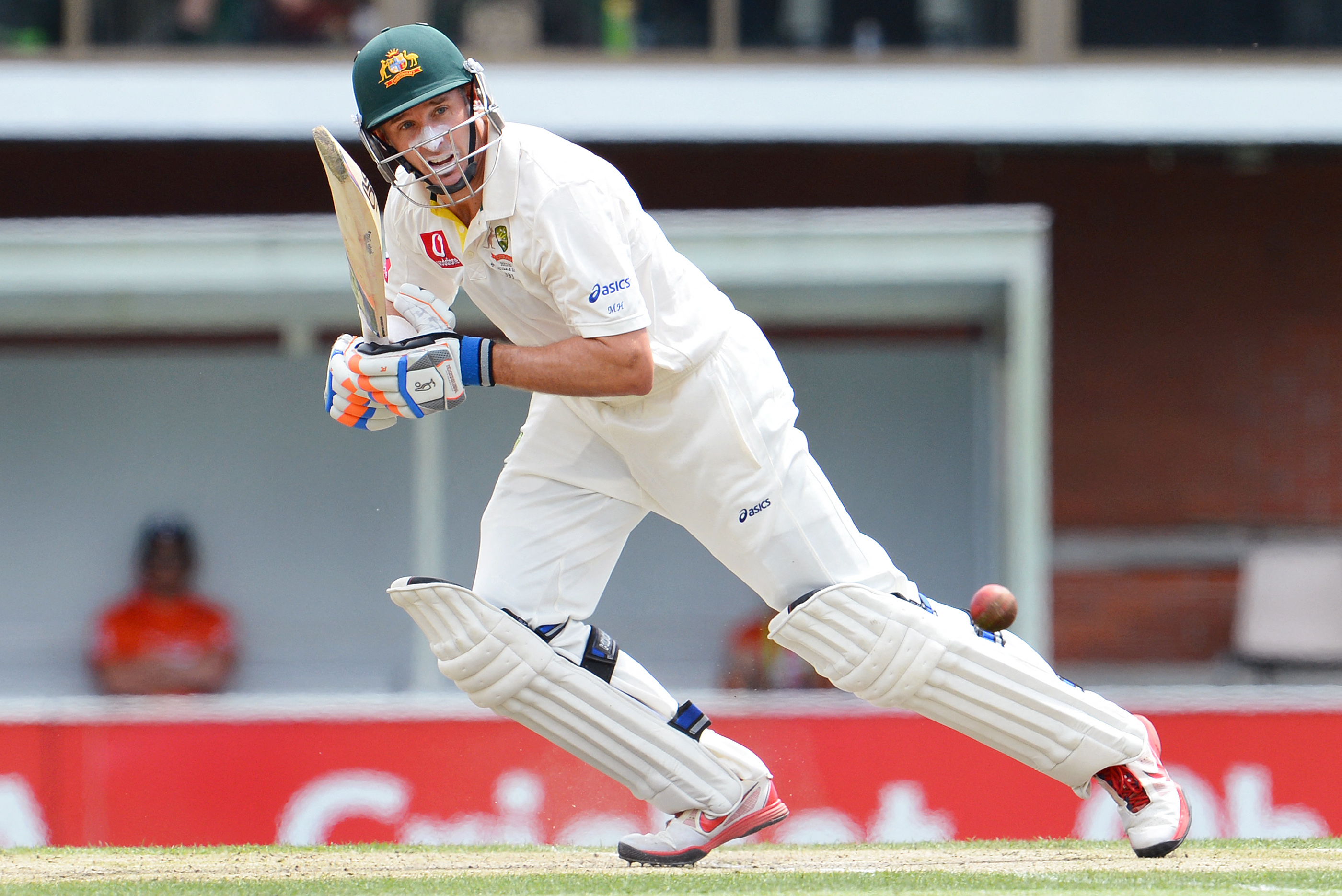Australian batsman Mike Hussey steers a ball away from the Sri Lanka bowling on the fourth day of the first cricket Test match, in Hobart on December 17, 2012. AFP PHOTO/William WEST IMAGE RESTRICTED TO EDITORIAL USE - STRICTLY NO COMMERCIAL USE (Photo by WILLIAM WEST / AFP)