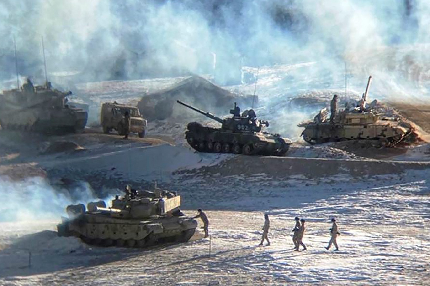 This undated handout photograph, released by the Indian army on February 16, 2021, shows People Liberation Army soldiers and tanks during a military disengagement along the Line of Actual Control (LAC) at the India-China border in Ladakh