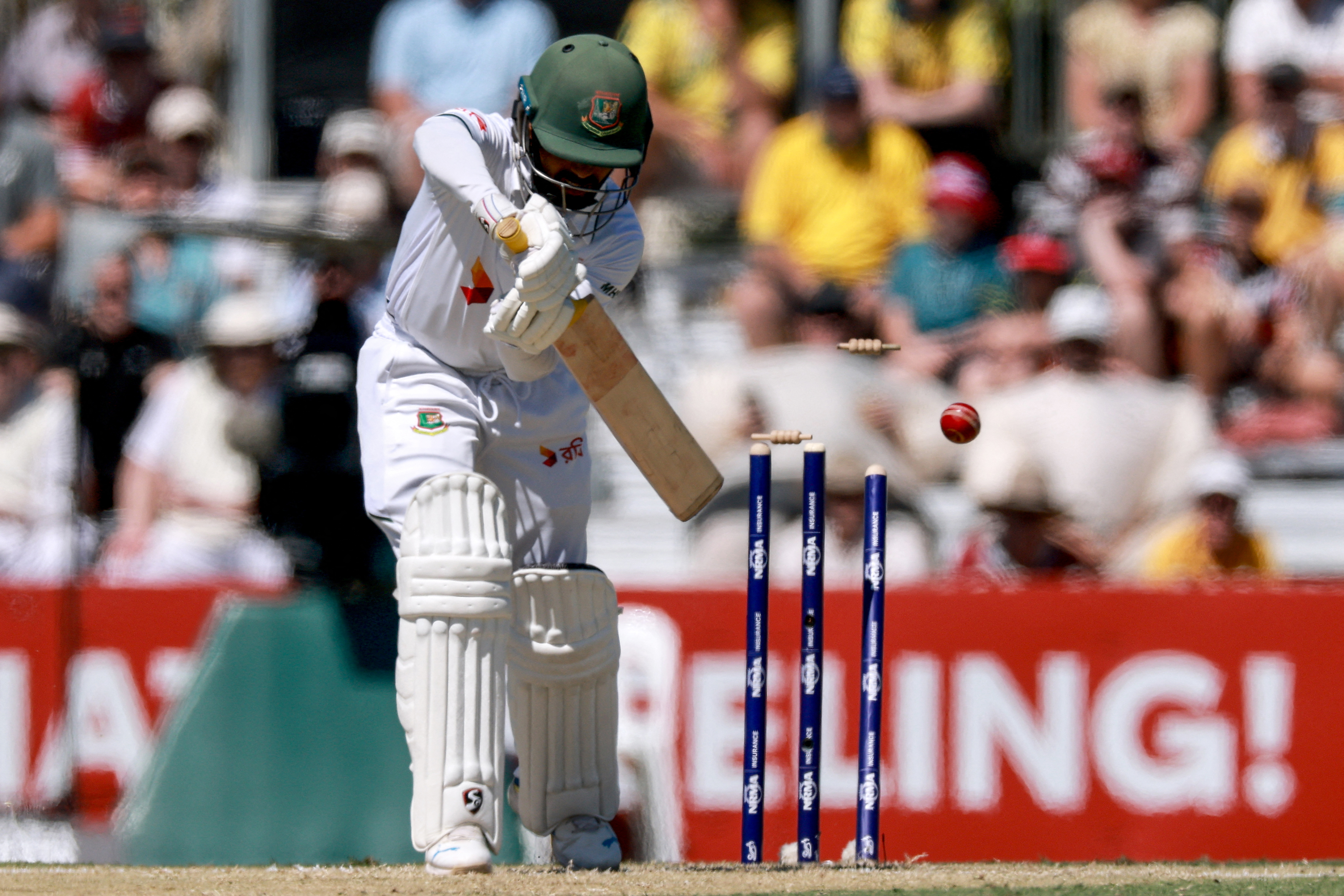 Bangladeshs Mominul Haque is bowled by Australias Mitchell Starc during the second day of the second cricket Test match between Australia and Bangladesh at the Great Barrier Reef Stadium in Mackay on August 23, 2026. (Photo by DAVID GRAY / AFP) / -- IMAGE RESTRICTED TO EDITORIAL USE - STRICTLY NO COMMERCIAL USE --