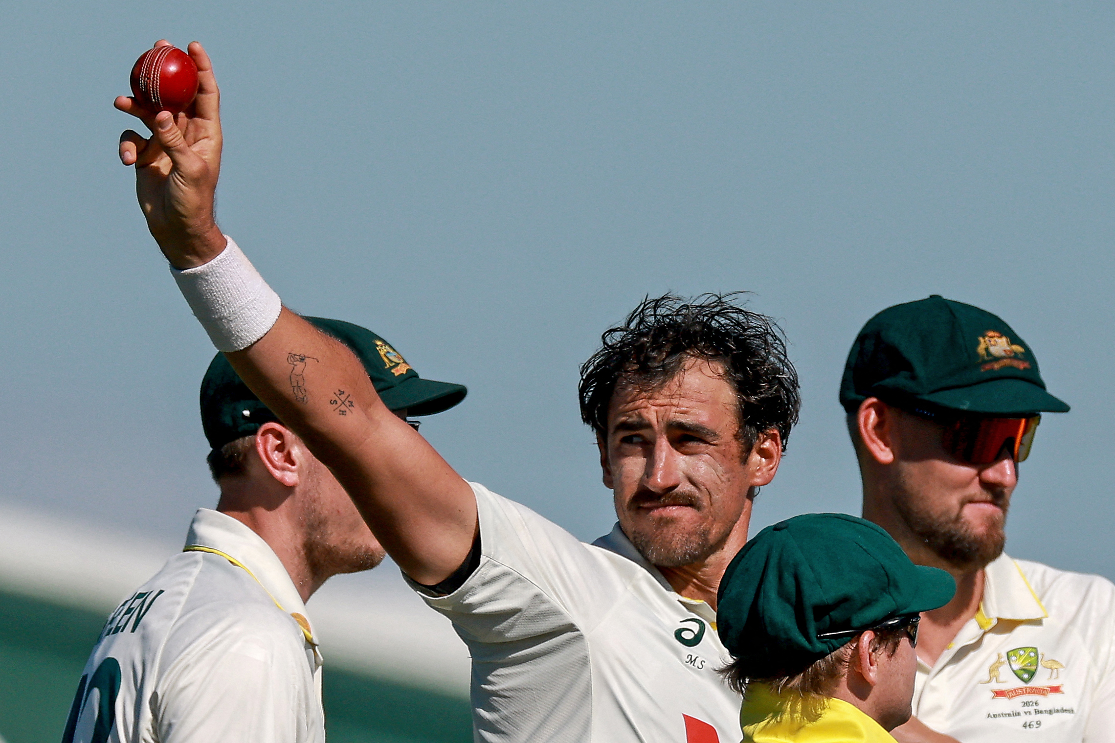 Mitchell Starc celebrates after taking his 10th wicket in the second Test against Bangladesh