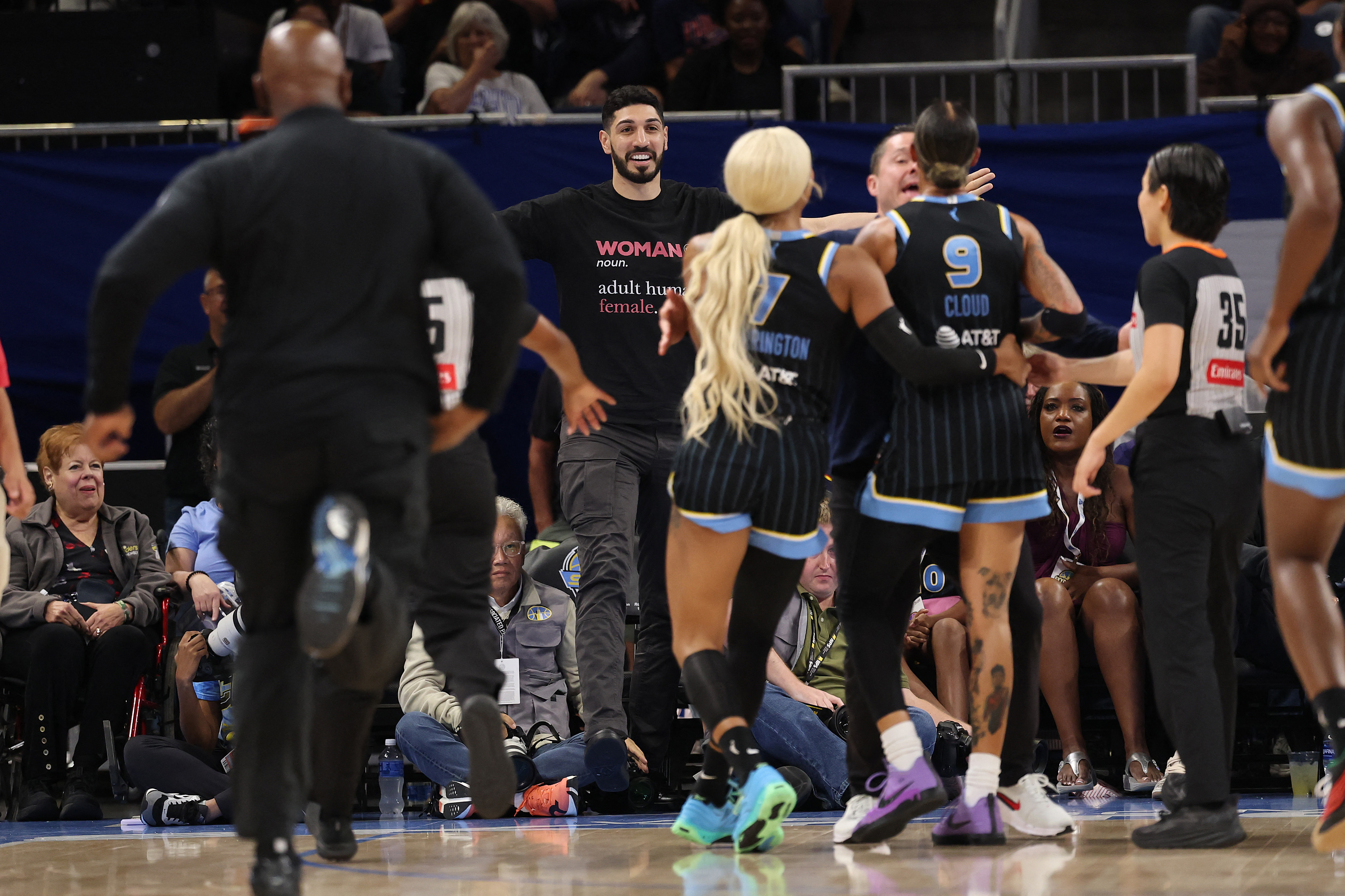 CHICAGO, ILLINOIS - AUGUST 23: Former basketball player Enes Kanter Freedom and Natasha Cloud #9 of the Chicago Sky yell at one another during the second half between the Chicago Sky and the Indiana Fever at Wintrust Arena on August 23, 2026 in Chicago, Illinois. NOTE TO USER: User expressly acknowledges and agrees that, by downloading and or using this photograph, User is consenting to the terms and conditions of the Getty Images License Agreement. Michael Reaves/Getty Images/AFP (Photo by Michael Reaves / GETTY IMAGES NORTH AMERICA / Getty Images via AFP)