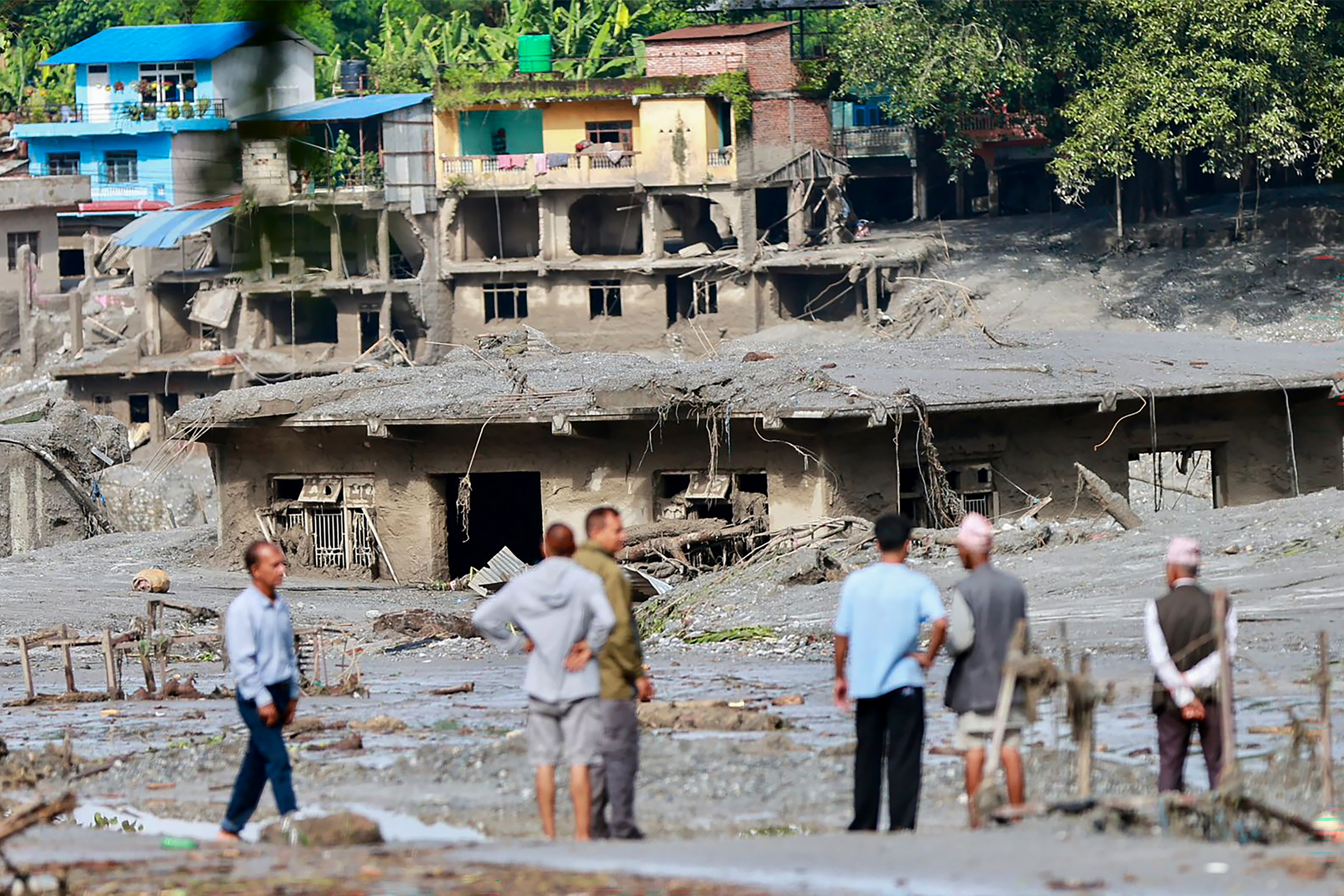 In Tibet, a mudslide that struck near the land border crossing of Gyirong Port on Wednesday left mud in the surrounding areas more than 1½ meters (5 feet) deep on average, with some road sections exceeding 2 meters (6 feet), Chinese state broadcaster CCTV reported.