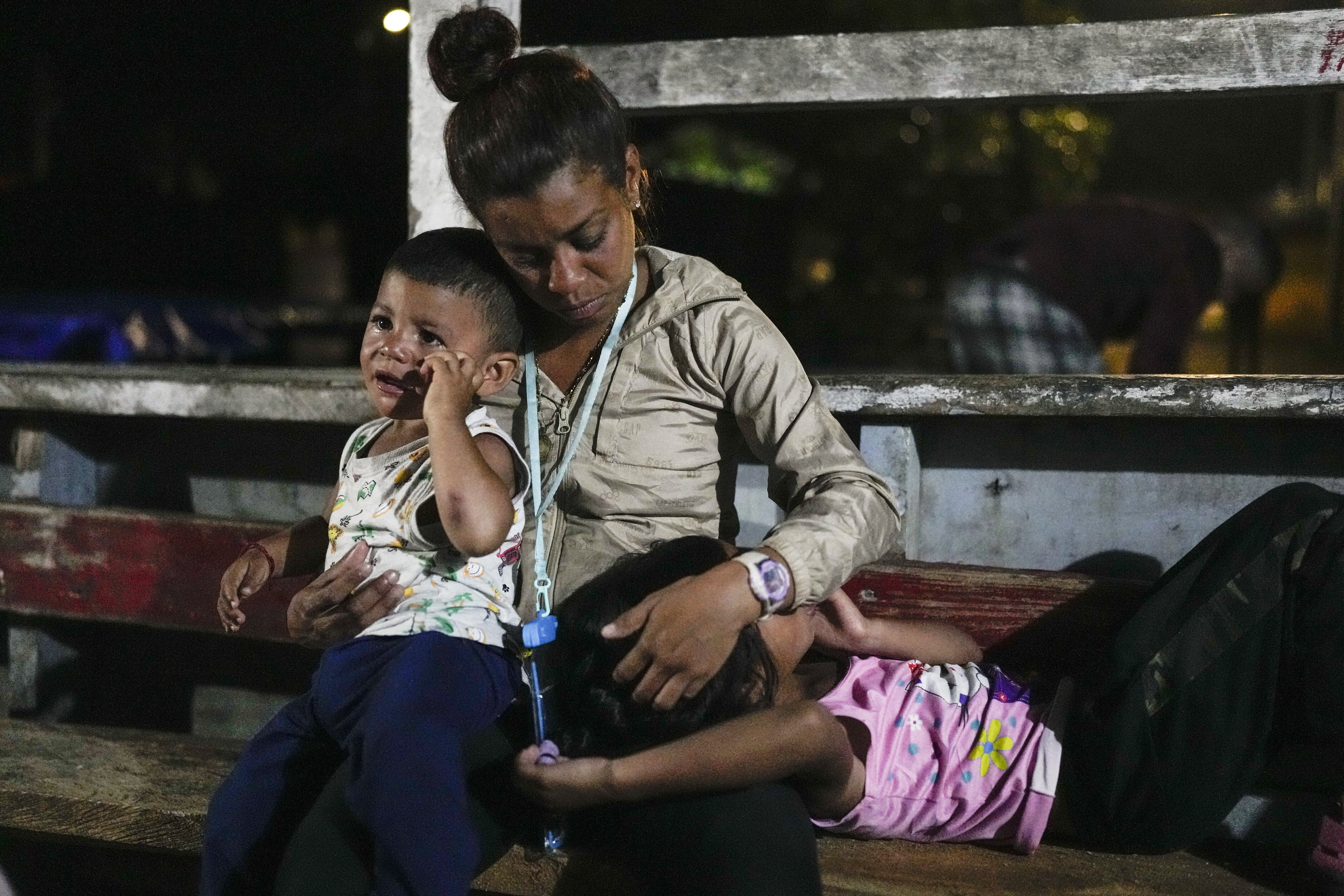 Venezuelan migrant Naomi Diaz sits on a boat departing from Panama's Caribbean coastal village of Miramar to the border with Colombia, Thursday, Feb. 27, 2025.