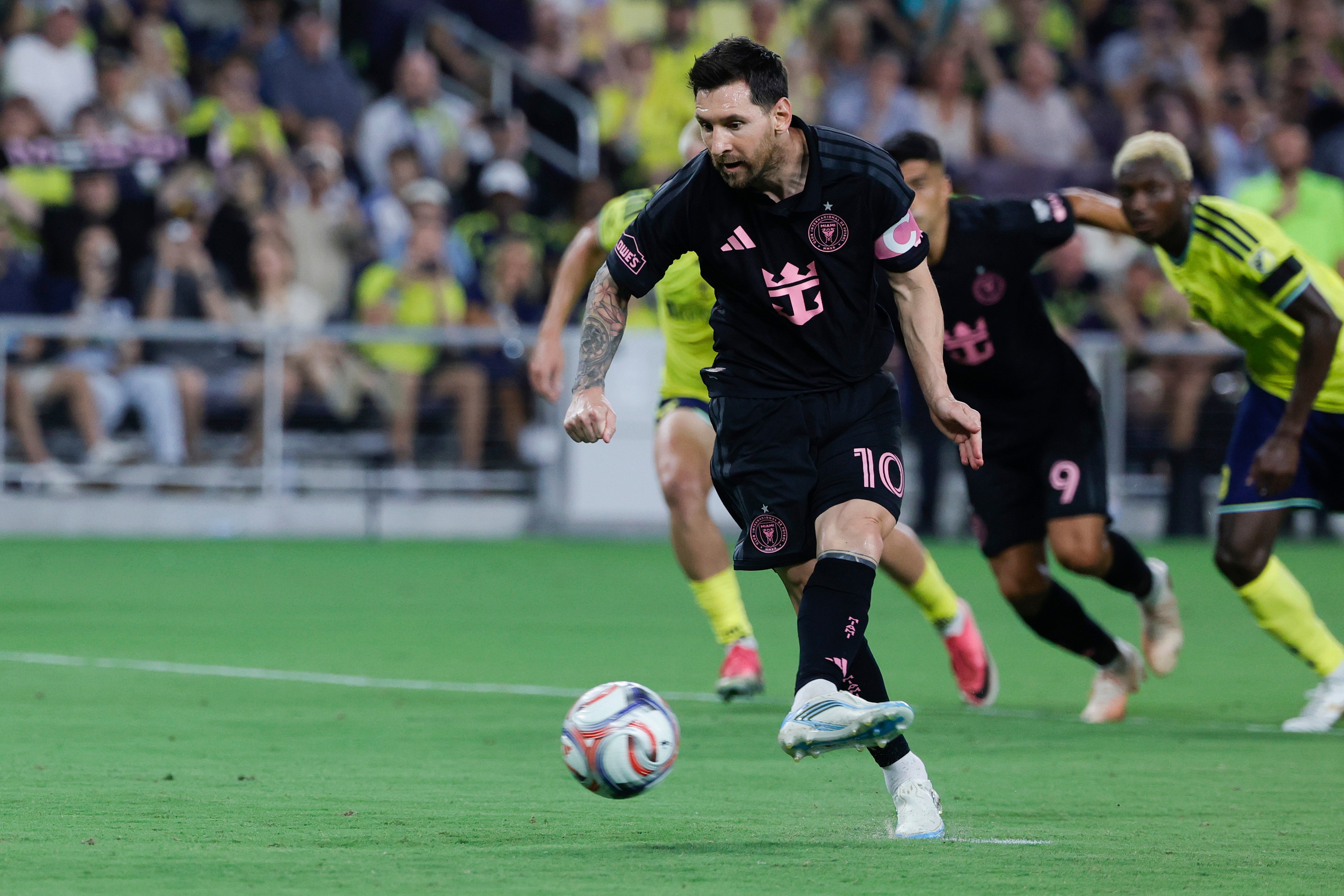 Inter Miami CF offense Lionel Messi (10) kicks a penalty during the first half of an MLS soccer match