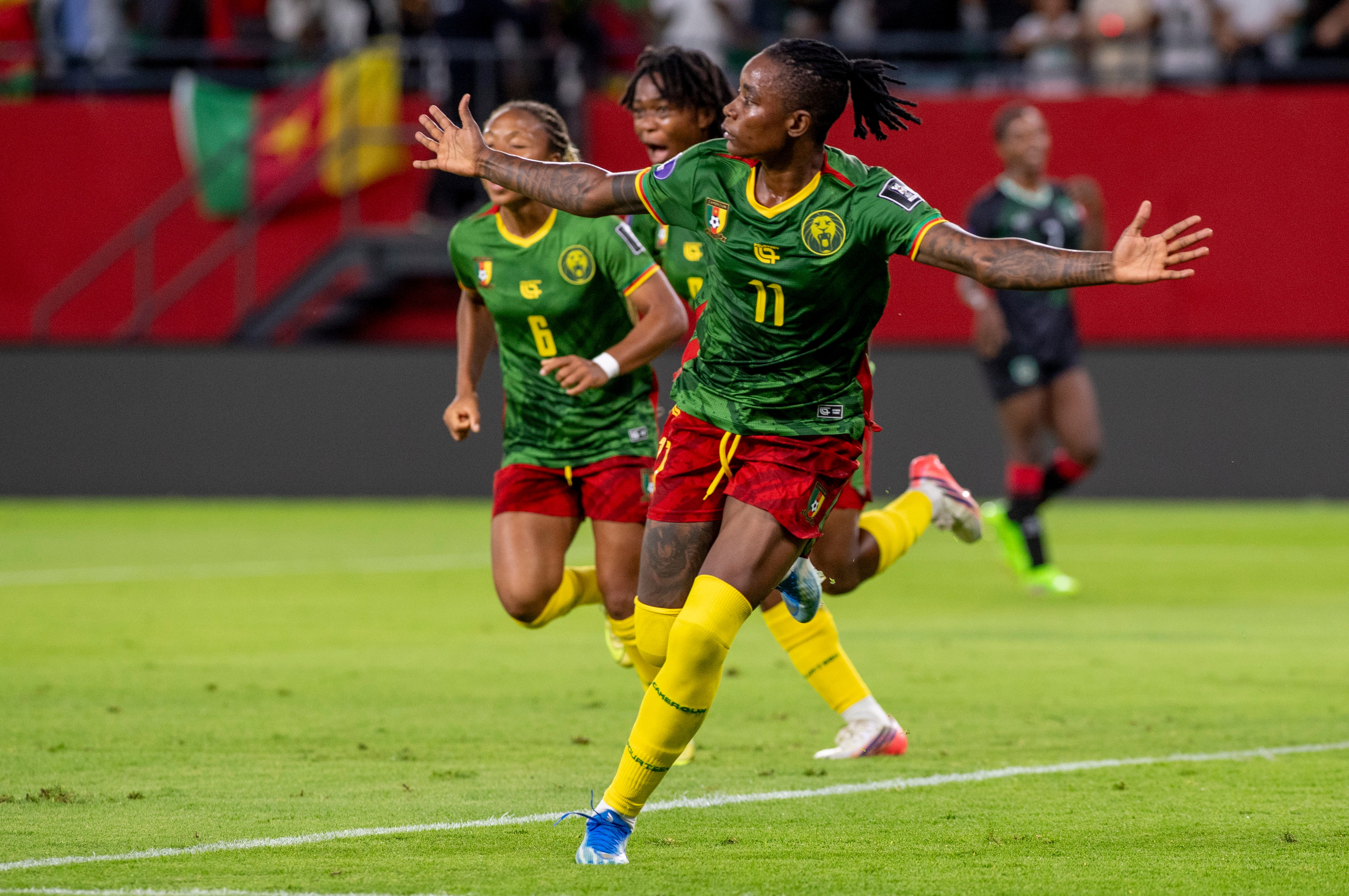 Cameroon’s Marie Ngah celebrates after scoring her team’s third goal against Malawi in the final [AP]