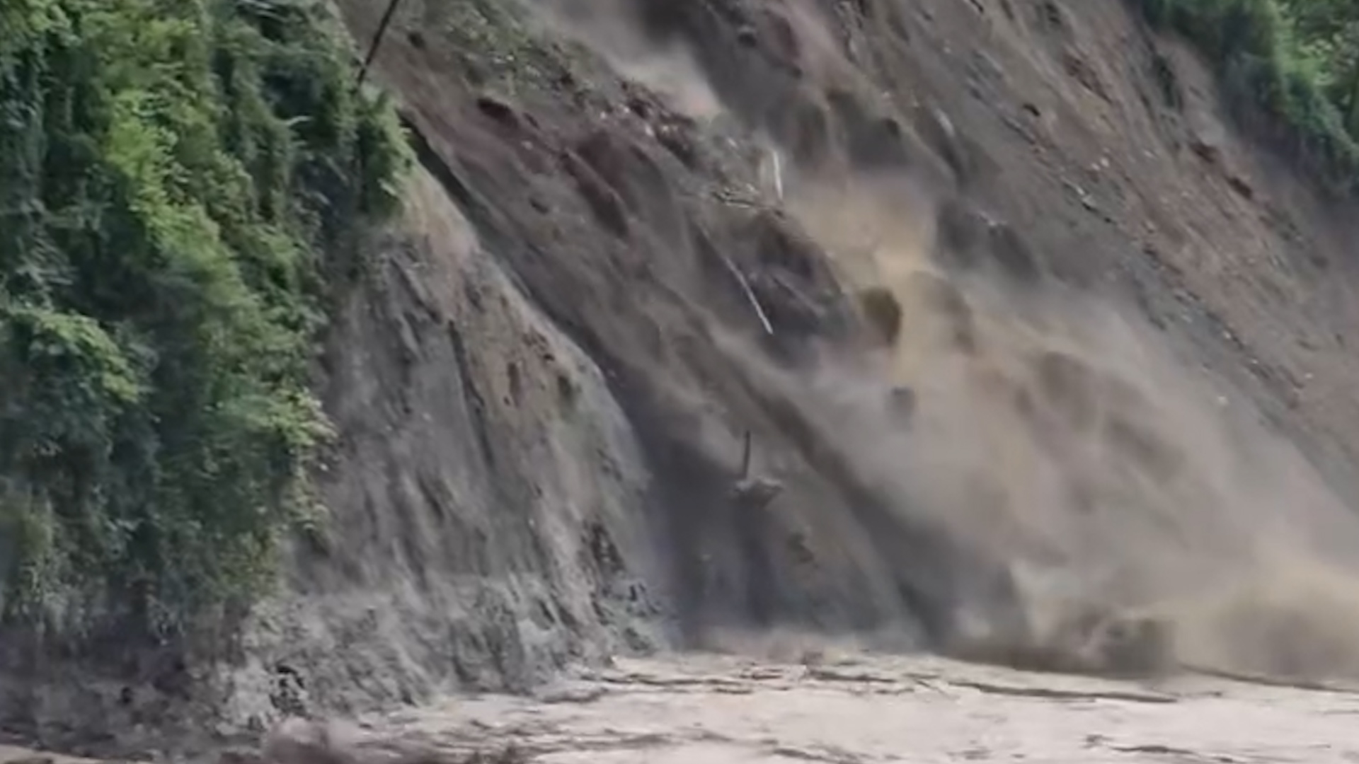 Scene of landslide into Trishuli River, Nepal.