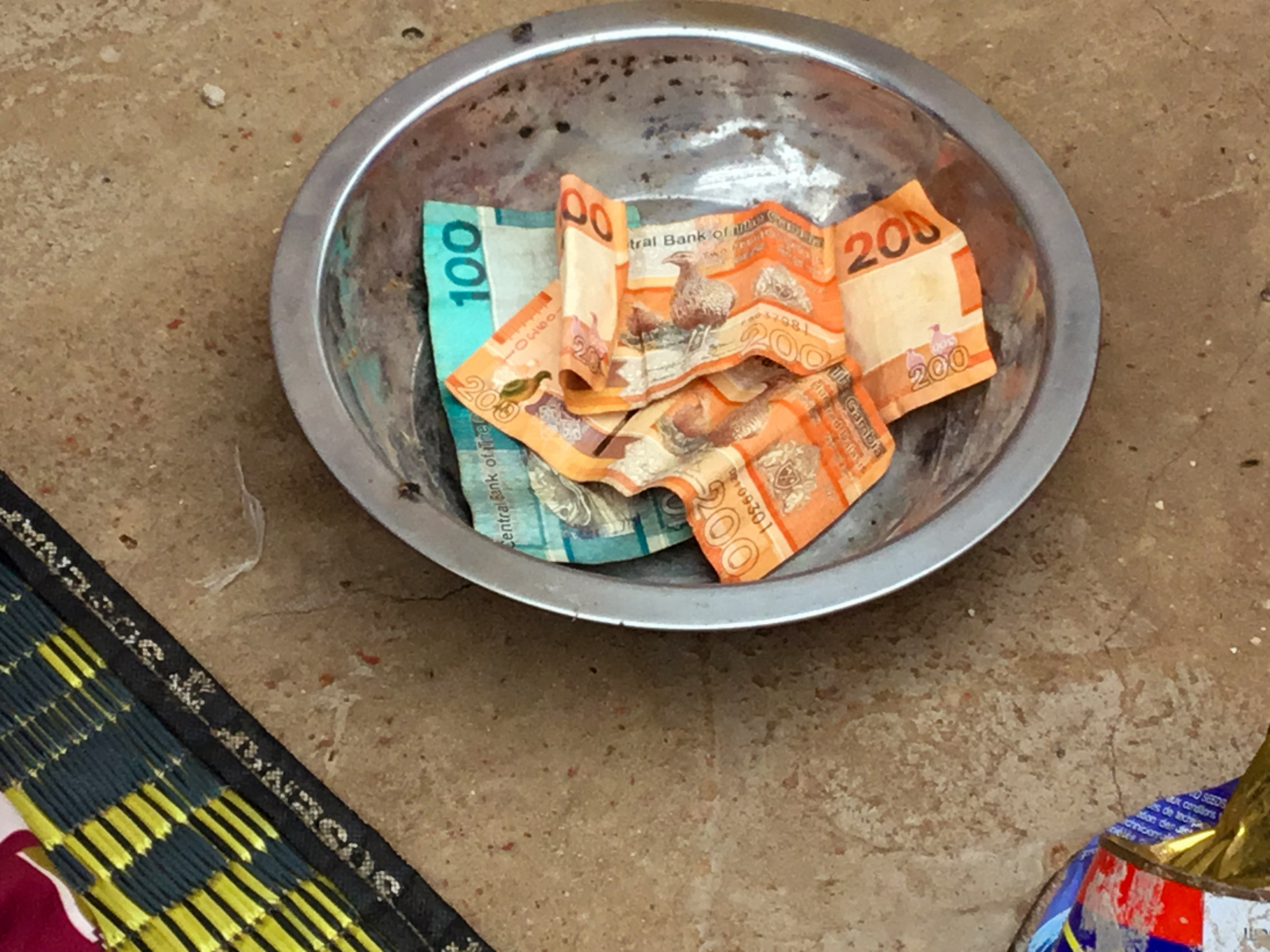 Contributions collected at a Kanyeleng gathering go into a shared fund used to help members in times of need