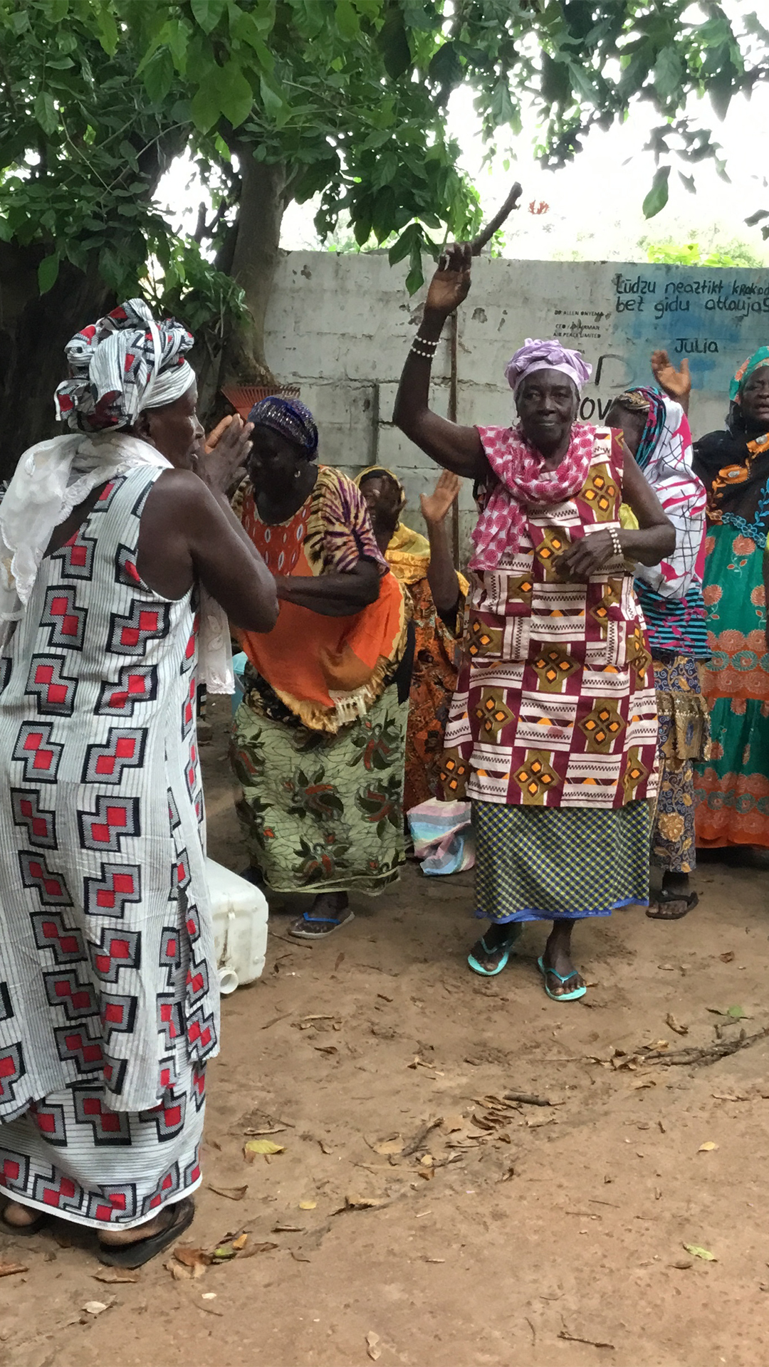 Kanyeleng women dance during a gathering in Bakau, keeping rhythm to songs passed down orally.