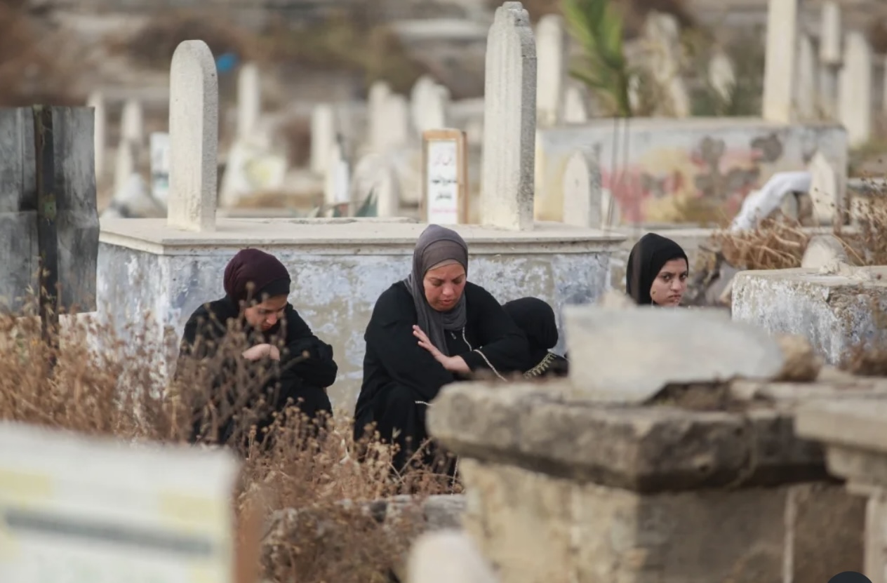 Palestinians visit the graves of their loved ones.
