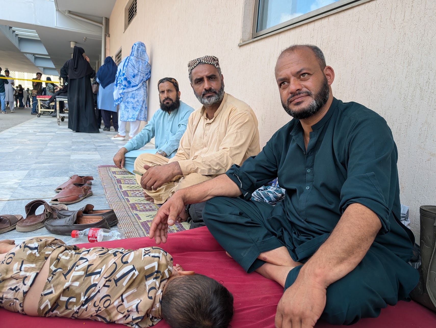 Arif Rana (right) sitting outside the maternity ward at PIMS on Wednesday, August 26, 2026