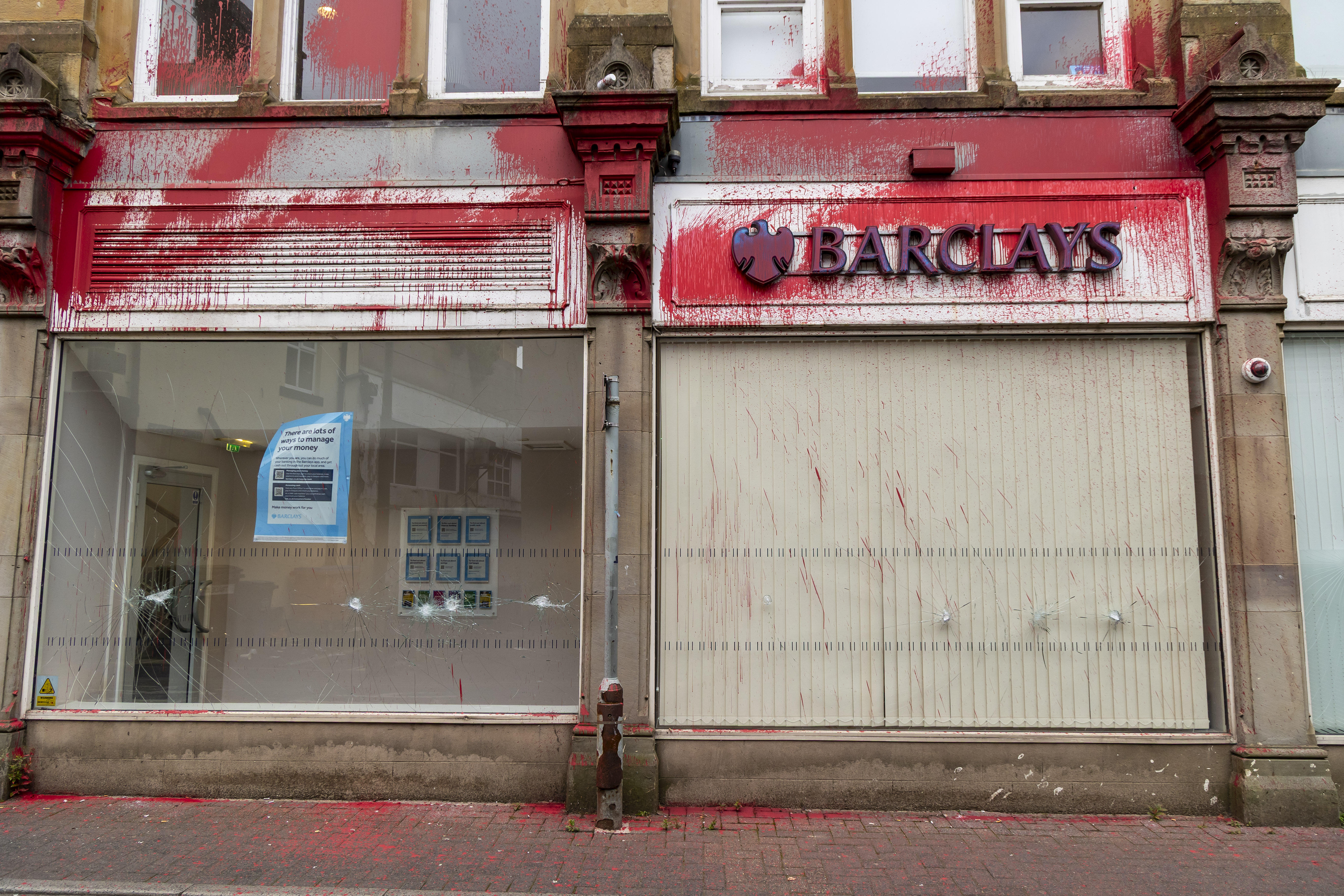 Pro-Palestine activists who vandalised a branch of Barclays in northern England in August 2024 over its investment in Israeli weapons manufacturer Elbit Systems could have faced terrorism sentences [Courtesy of Defend Our Juries]