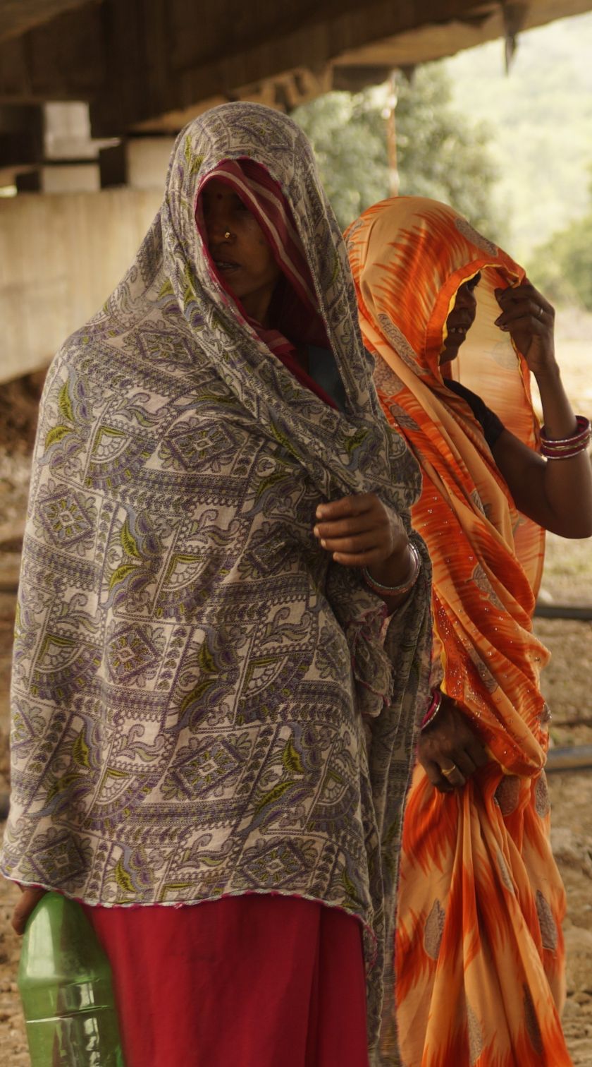 Protesters gather beside the Barna River near Kupi village in Madhya Pradesh