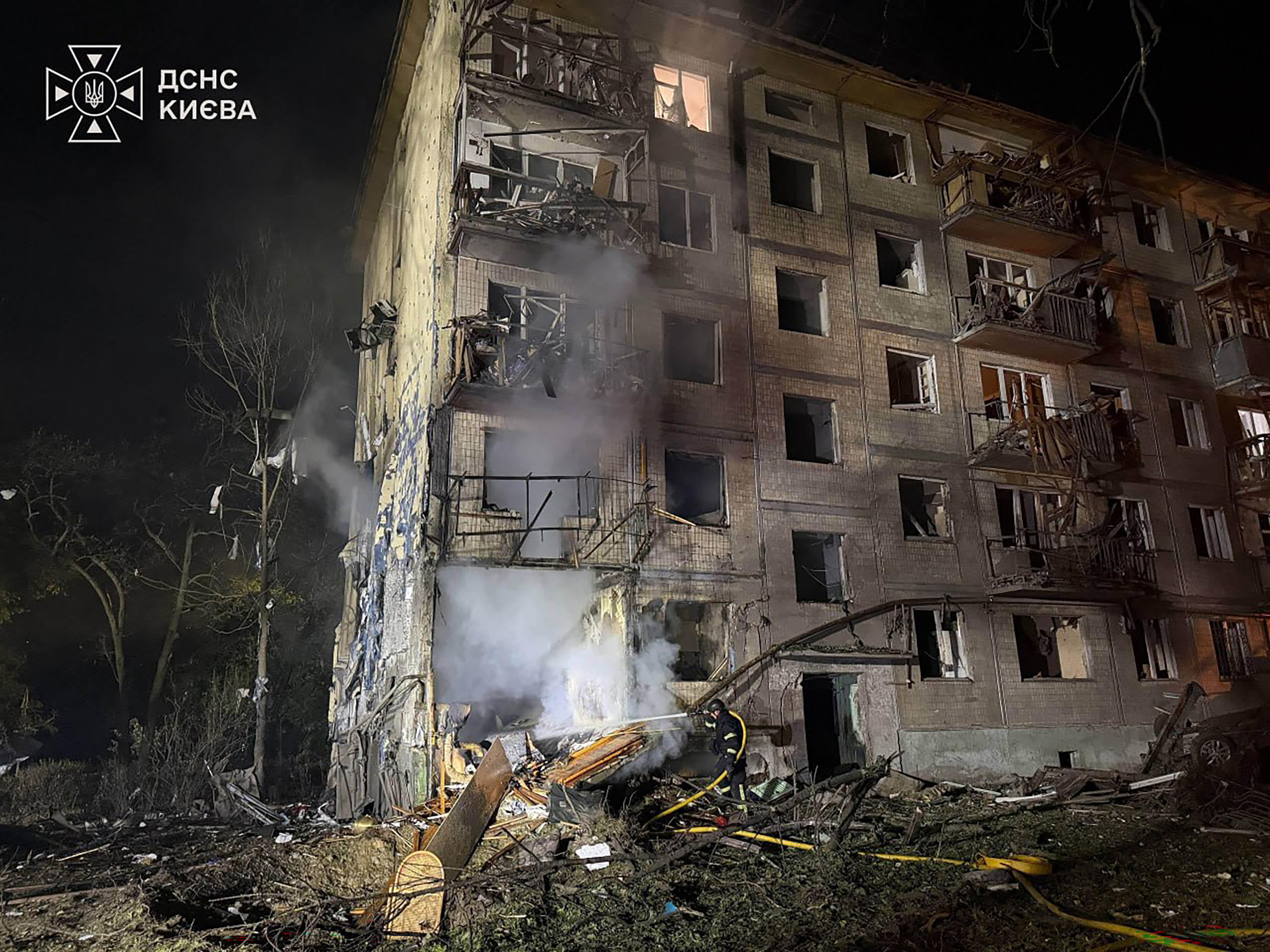 This handout photograph taken and released by Ukrainian State Emergency Service on August 1, 2026 shows rescuers working outside a multi-storey residential building damaged following massive Russian ballistic missile strikes in the Ukrainian capital of Kyiv, amid the Russian invasion in Ukraine.