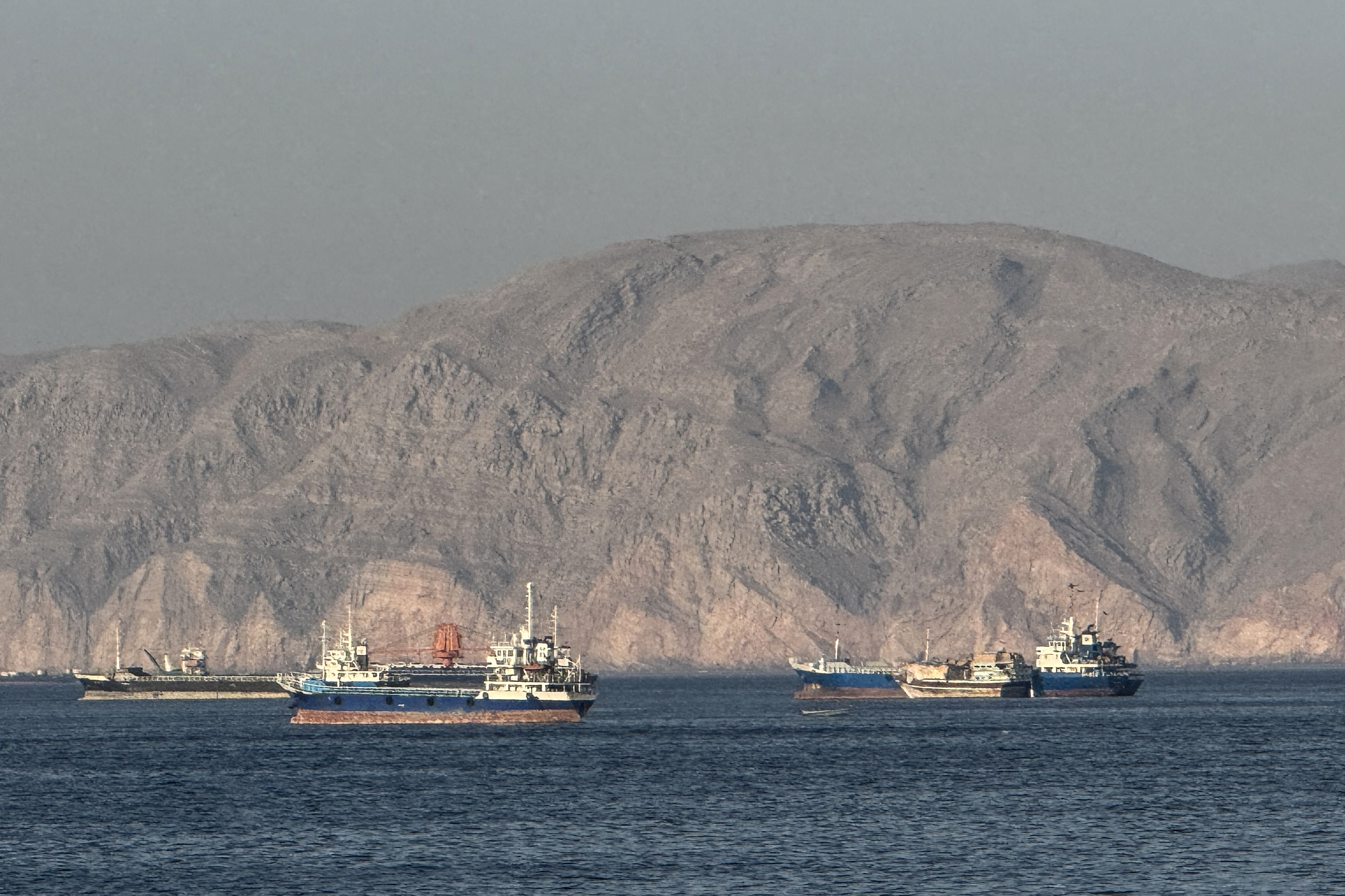 (FILES) Vessels are seen anchored in the Strait of Hormuz, off the port city of Khasab on Oman’s northern Musandam Peninsula on May 17, 2026.