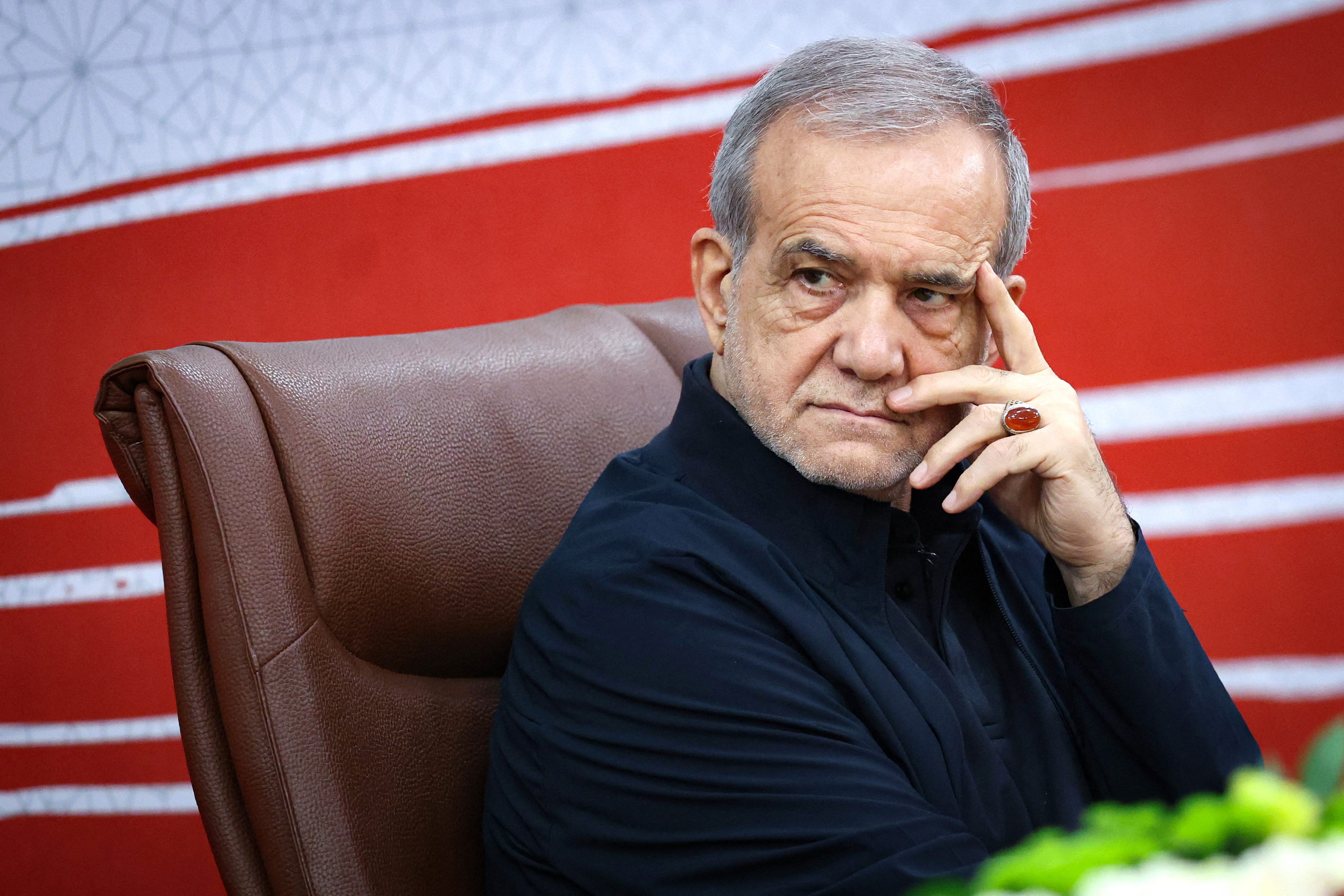A handout photo made available by the Iranian Presidential Office shows Iran's President Masoud Pezeshkian attending a press conference in the capital Tehran, on August 8, 2026.