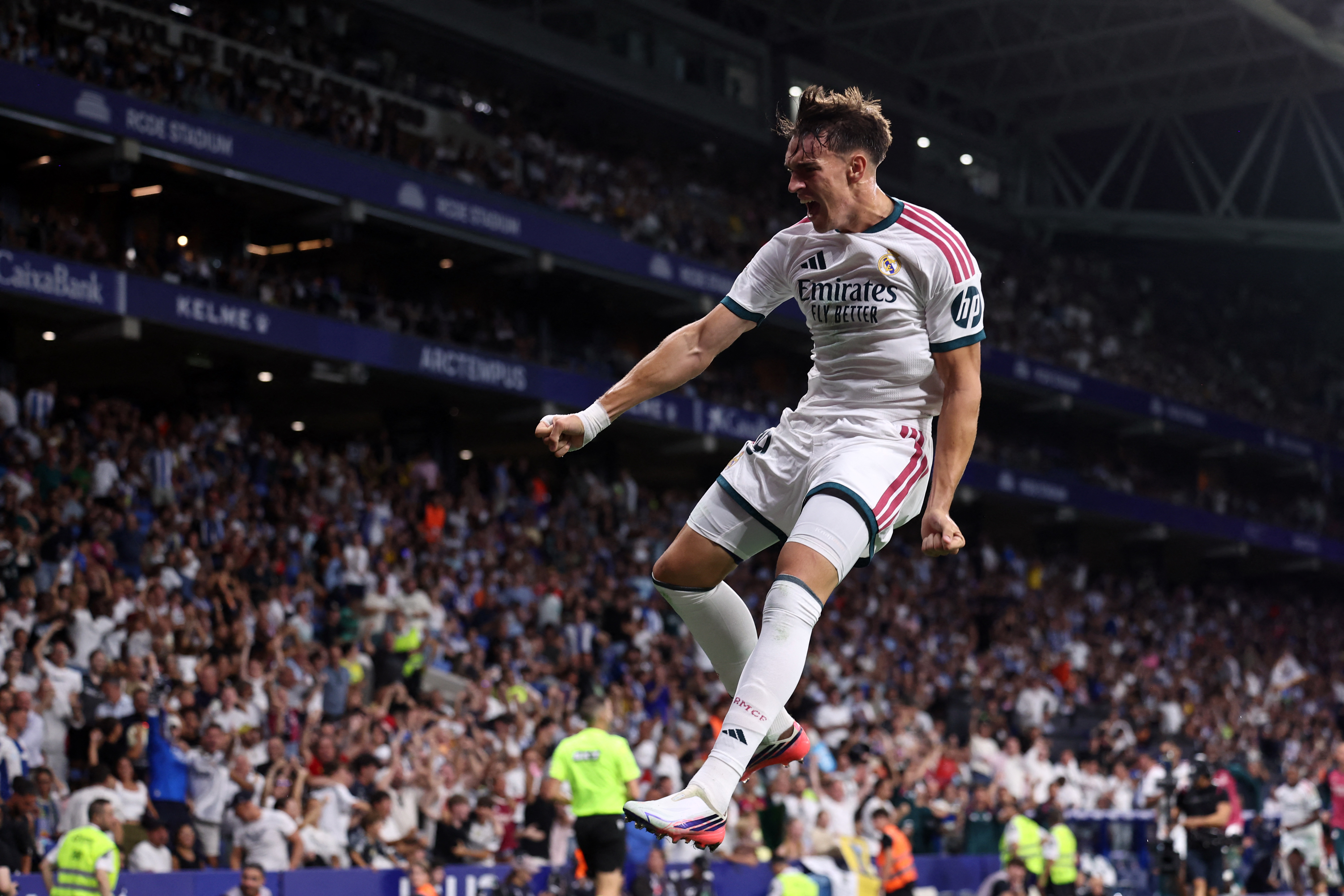 Real Madrid's Spanish forward #19 Carlos Espi Escrihuela celebrates scoring his team's second goal during the Spanish league football match between RCD Espanyol and Real Madrid CF at RCDE Stadium in Cornella de Llobregat on August 22, 2026. (Photo by Josep LAGO / AFP)