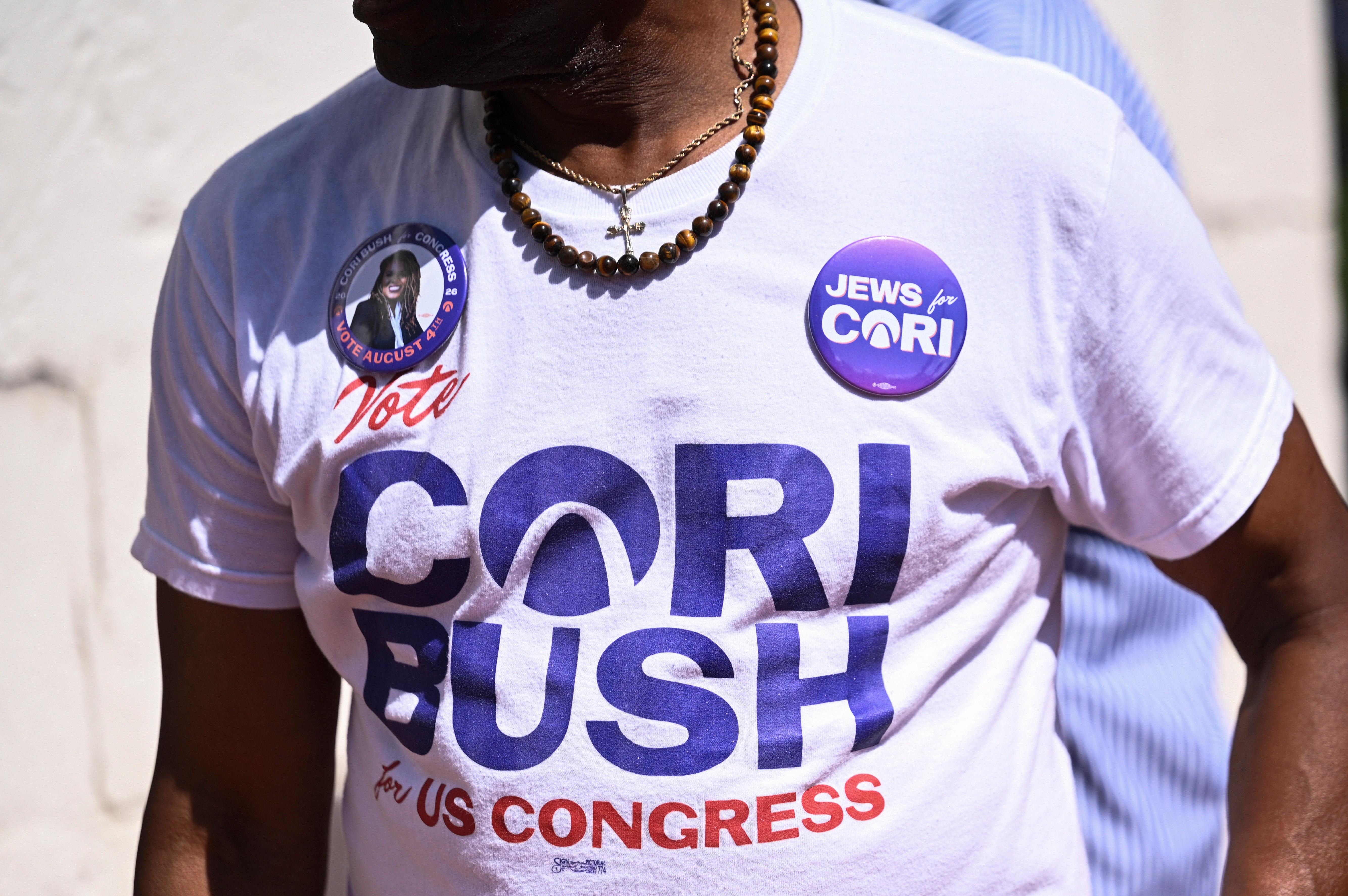 A supporter of former Rep. Cori Bush, D-Mo., wears a campaign shirt during a rally on Saturday, July 18, 2026, in St. Louis. (AP Photo/Michael Thomas)
