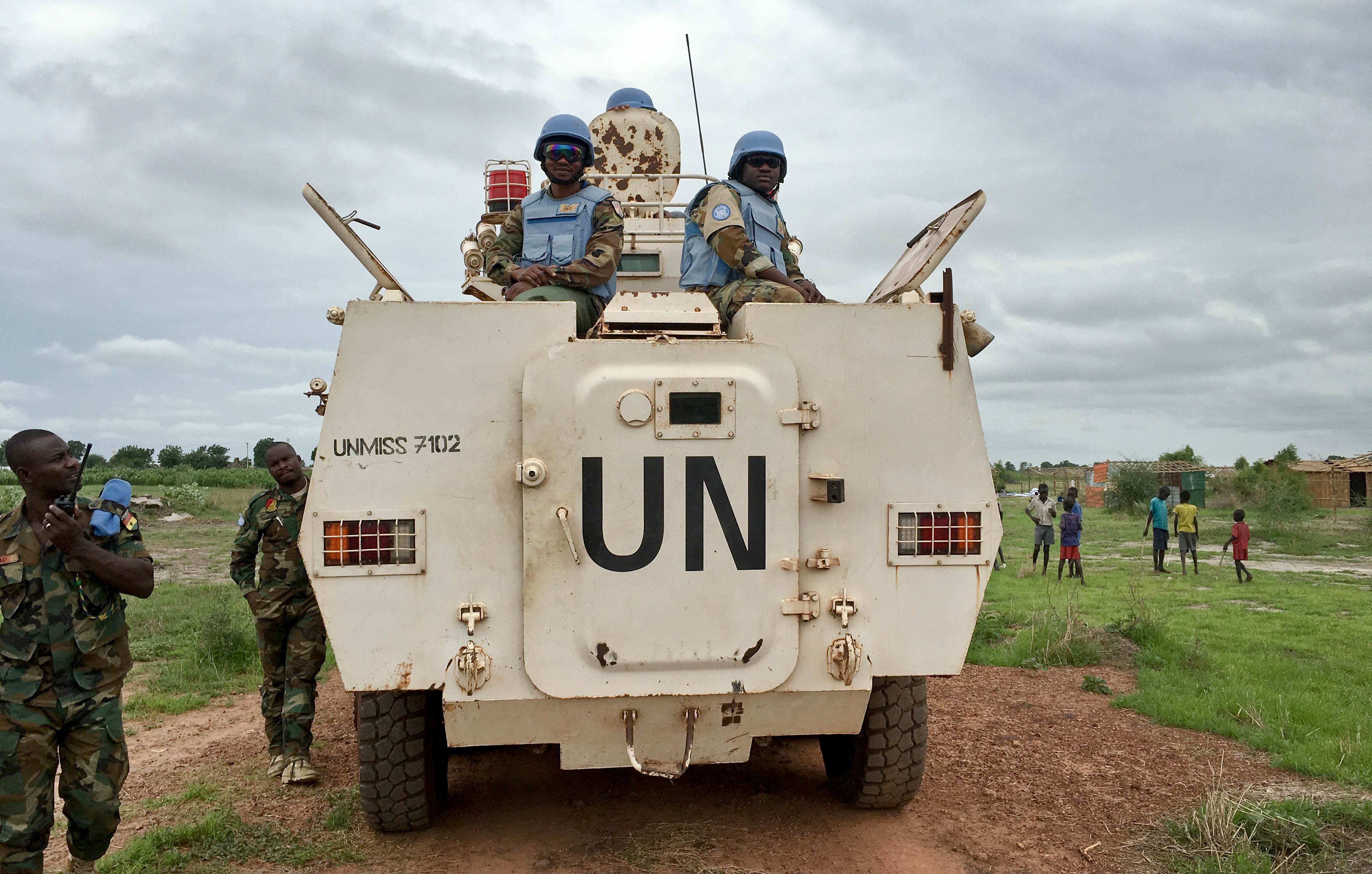 FILE - In this Sunday, June 18, 2017 file photo, peacekeepers from the United Nations Mission in South Sudan (UNMISS) provide security during a visit of UNCHR High Commissioner Filippo Grandi to the U.N. Protection of Civilians camp in Bentiu, South Sudan. (AP Photo/Sam Mednick, File)