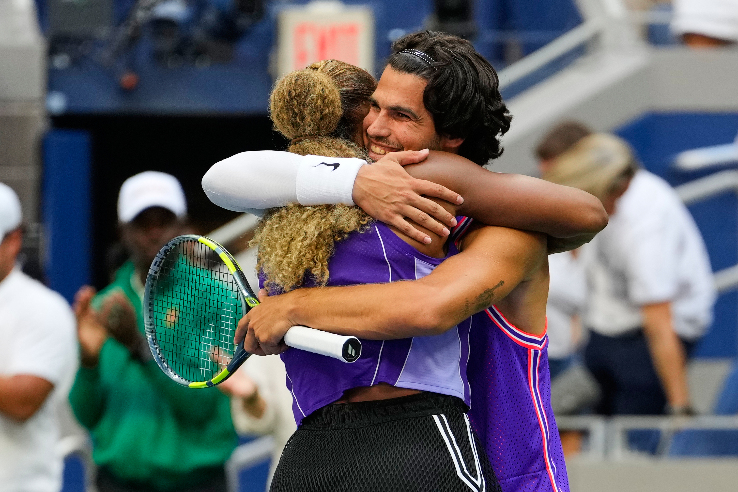 Serena Williams, of the United States, and Carlos Alcaraz, of Spain, celebrate after winning a mixed doubles match at the U.S. Open tennis championships, Tuesday, Aug. 25, 2026, in New York. (AP Photo/Yuki Iwamura)