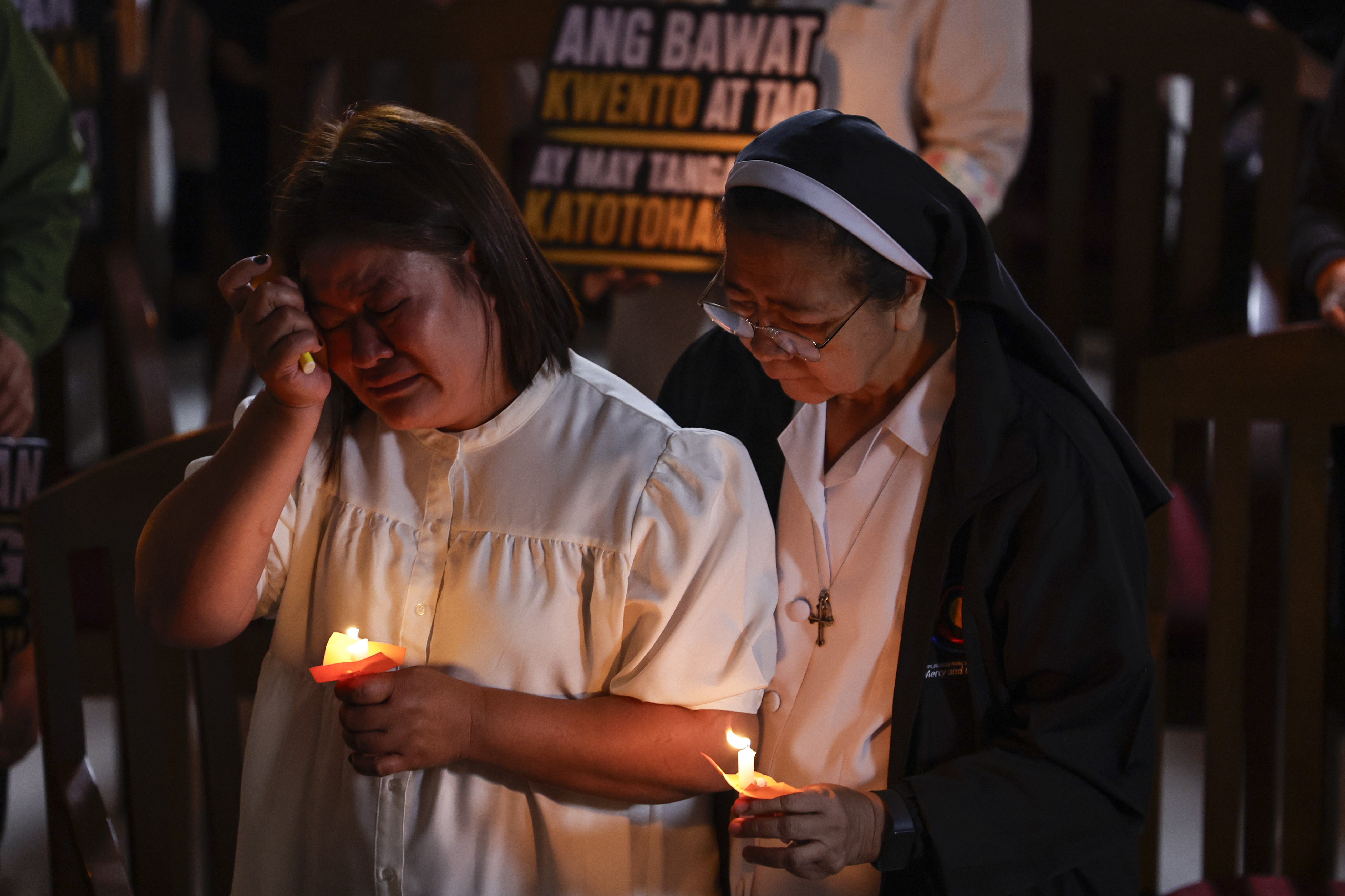 epaselect epa13168655 Luzviminda Siapo (L), whose son Raymart is believed to have been a victim of an extrajudicial killing in March 2017 during former President Rodrigo Duterte's anti-illegal drugs campaign, reacts at the close of a Truth Commission session at a Catholic facility in Manila, Philippines, 14 August 2026. The civilian-led commission held the session to document acts of violence during Duterte's anti-drug campaign and formulate evidence-based recommendations for prosecution, institutional reform and healing. Duterte remains detained in The Hague, facing charges of crimes against humanity before the International Criminal Court. EPA/ROLEX DELA PENA