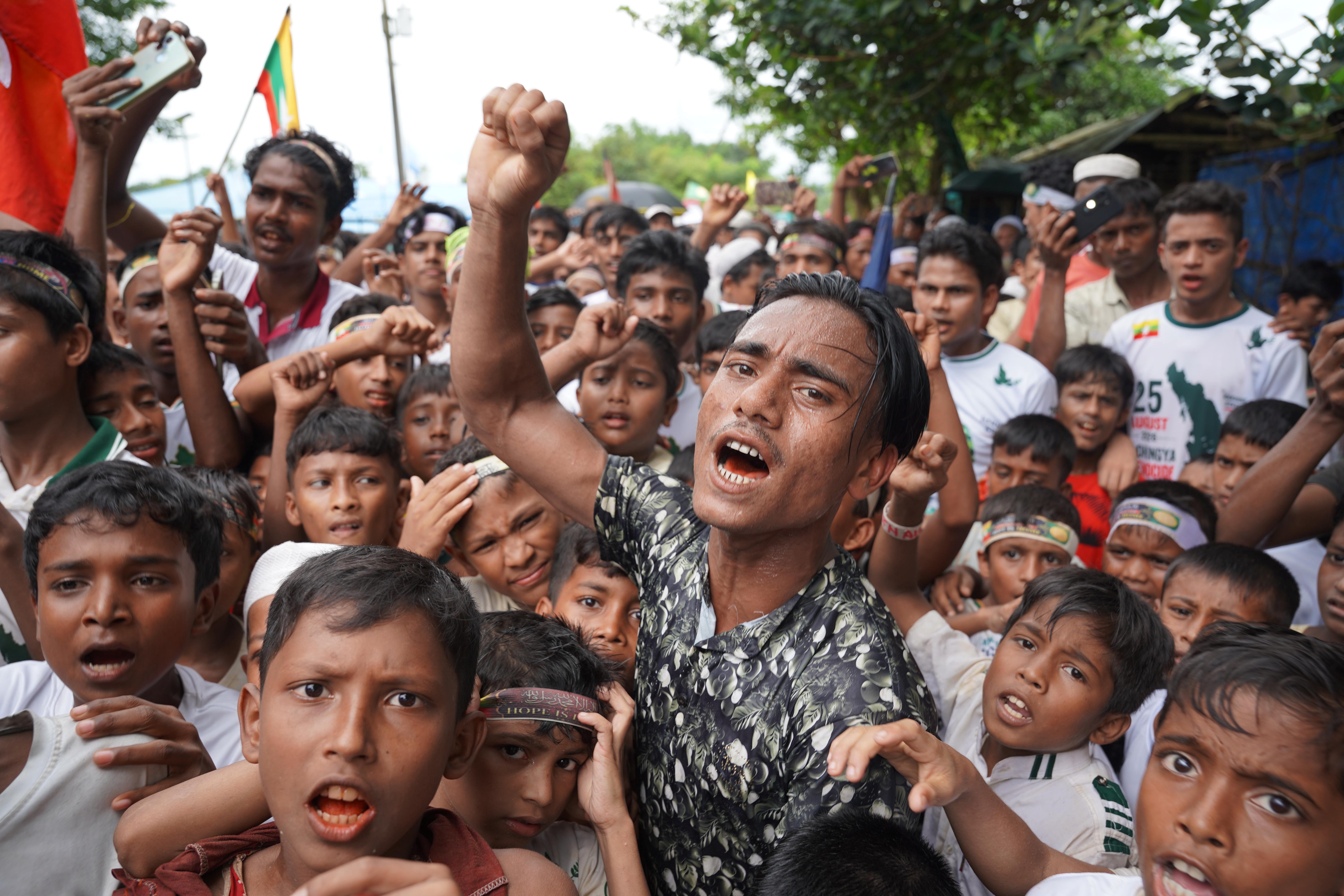 epa13190376 Rohingya refugees gesture as they take part in a rally to mark Genocide Remembrance Day, on the ninth anniversary of their mass exodus from Myanmar, at a refugee camp in Cox's Bazar, Bangladesh, 25 August 2026. Thousands of Rohingya refugees protested against deteriorating living conditions and demanded a safe return to Myanmar, nine years after a military crackdown drove them across the border. EPA/YASSIN ABDUMONAB