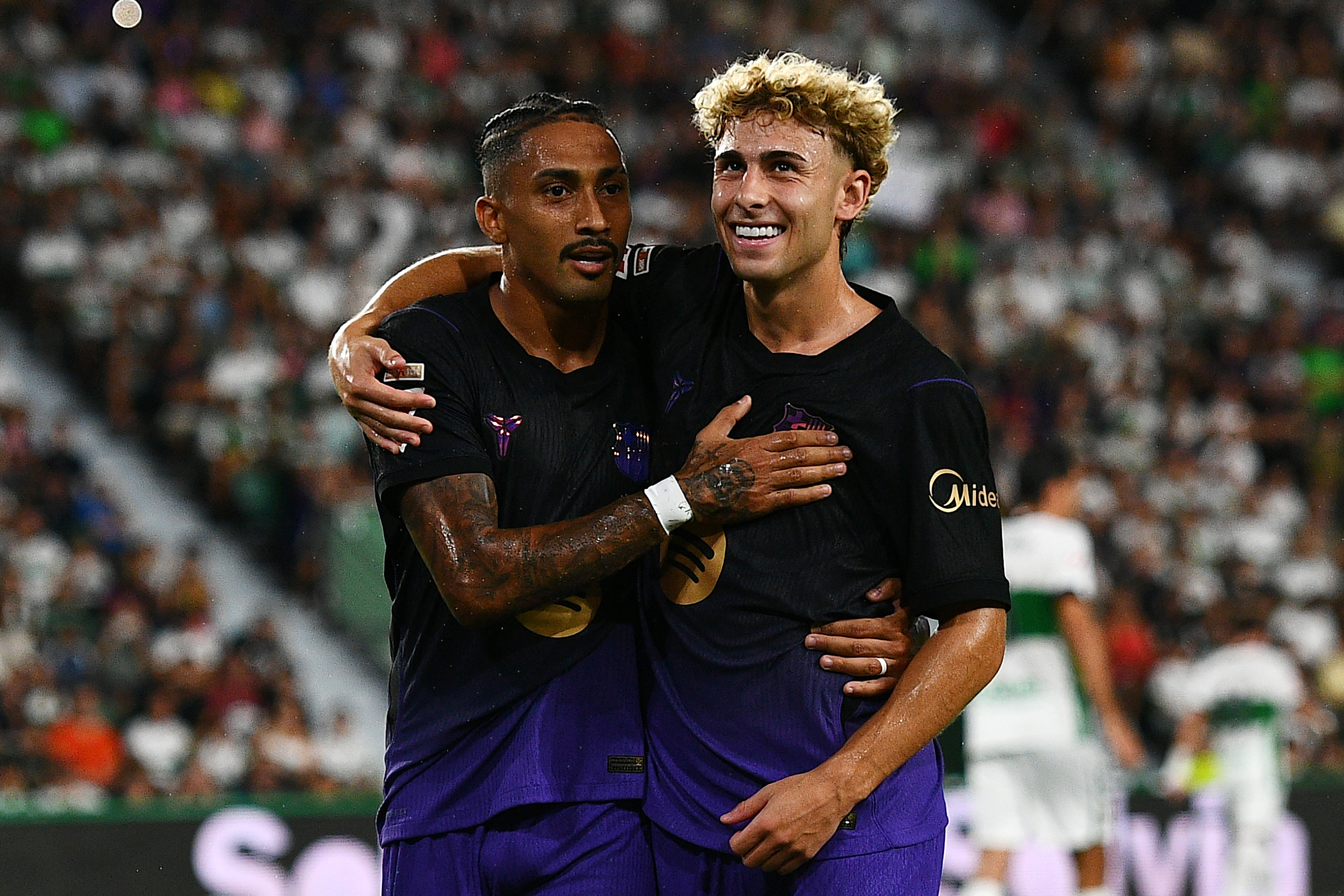 ELCHE, SPAIN - AUGUST 23: Raphinha of Barcelona celebrates scoring his team’s first goal with team mate Fermin Lopez during the LaLiga EA Sports 2026/27 match between Elche CF and FC Barcelona at Estadio Manuel Martinez Valero on August 23, 2026 in Elche, Spain. (Photo by Francisco Macia/Getty Images)