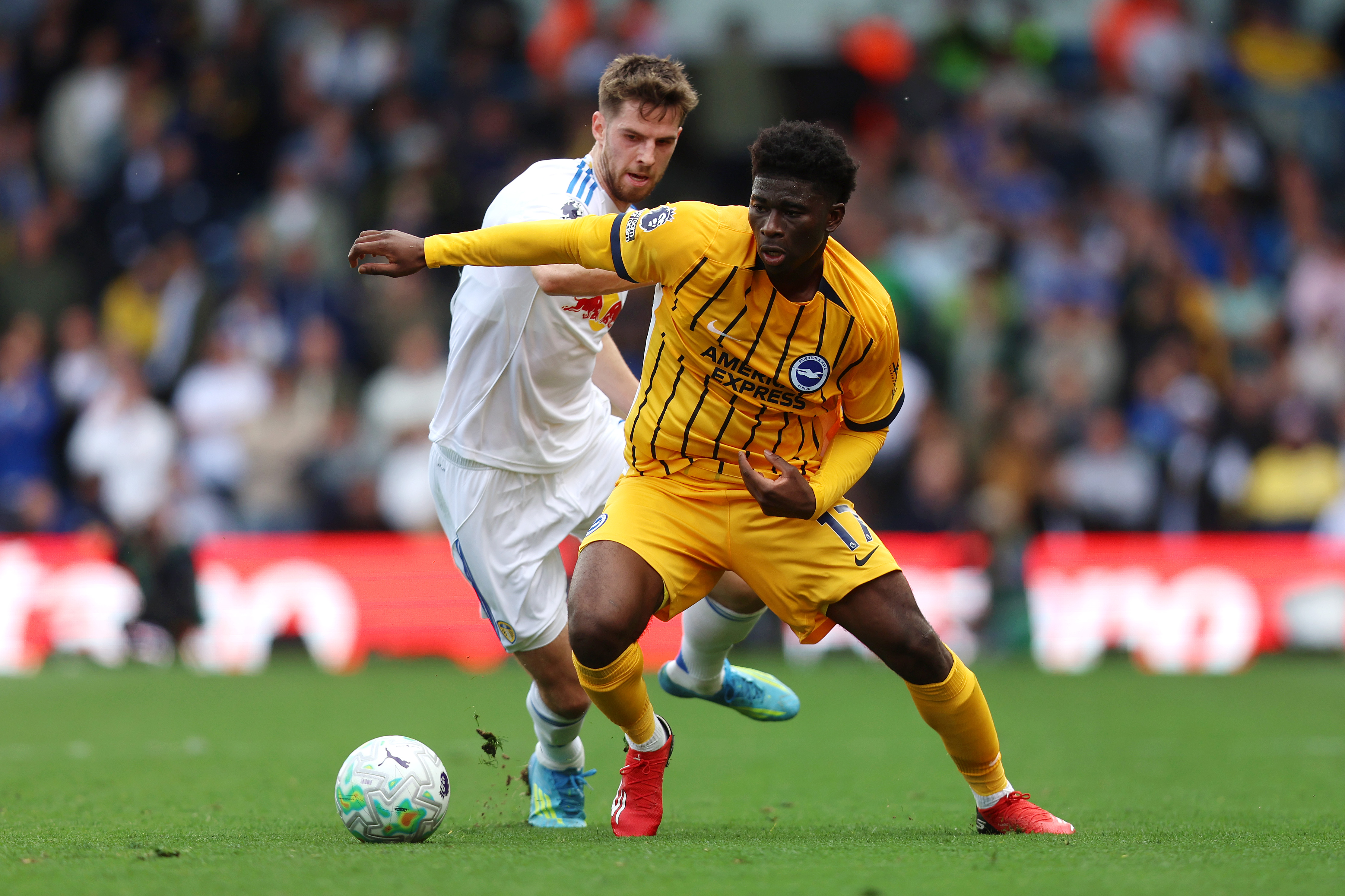 LEEDS, ENGLAND - MAY 17: Carlos Baleba of Brighton & Hove Albion is put under pressure by Anton Stach of Leeds United during the Premier League match between Leeds United and Brighton & Hove Albion at Elland Road on May 17, 2026 in Leeds, England. (Photo by Nathan Stirk/Getty Images)