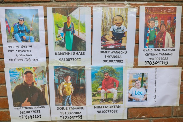 A wall on the Tribhuvan University hospital where families have stuck posters of missing relatives, in Kathmandu, Nepal [Mohammad Meherban/ Al Jazeera]