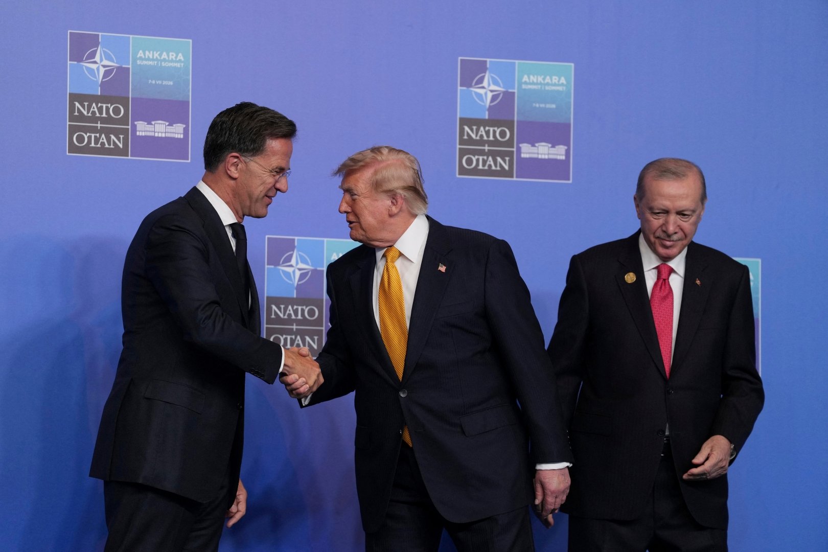 U.S. President Donald Trump, is greeted by Turkish President Recep Tayyip Erdogan, and NATO Secretary General Mark Rutte as he arrives for the NATO summit in Ankara, Turkey, Wednesday, July 8, 2026. [Alastair Grant/Pool via Reuters]