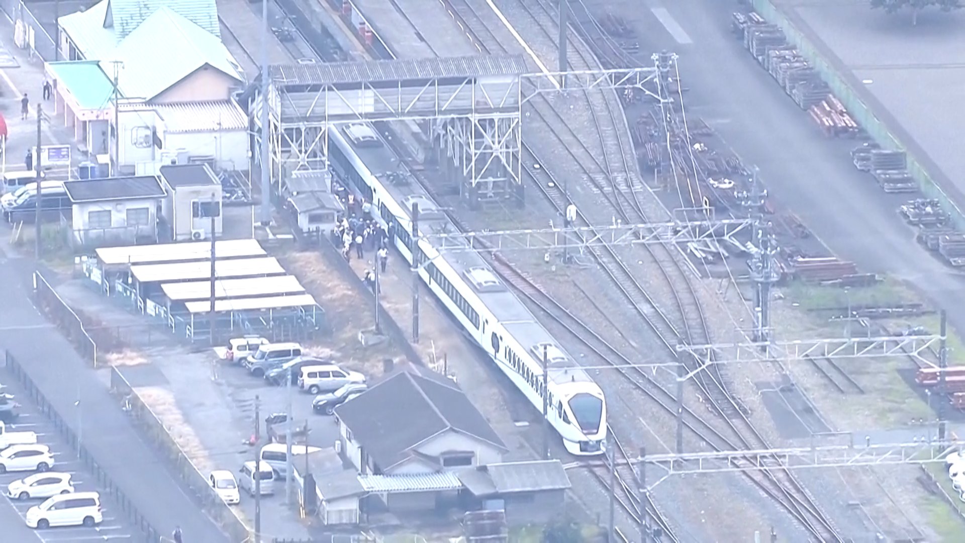 Aerials of workers and police on a railway platform at Shin Kanuma station following train crash north of Tokyo, on the Tobu Nikko Line. Kanuma, Japan, August 20, 2026. [Screenshot from Associate Press file]