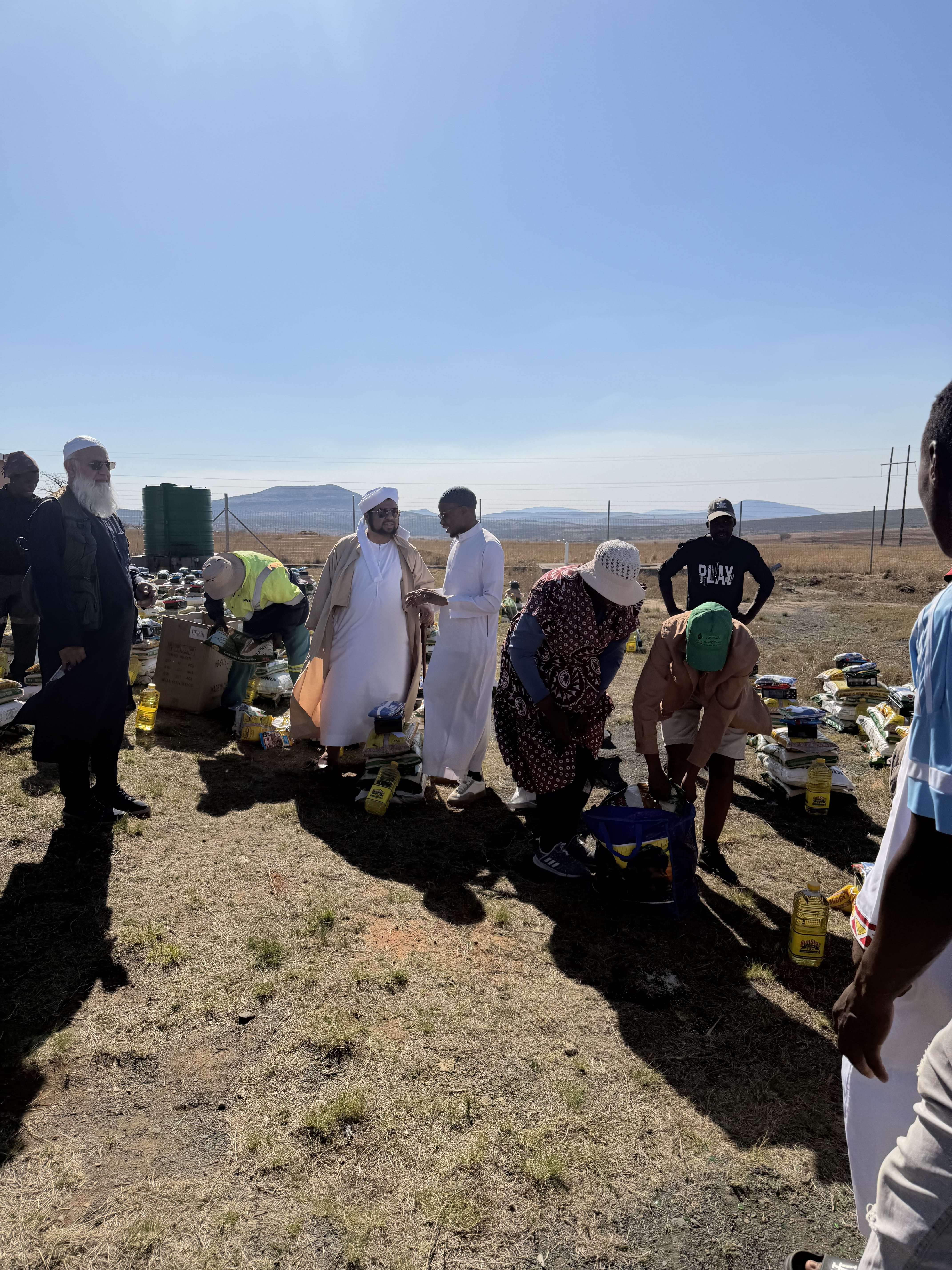 Khethukuthula Dlame distributes aid to members of his community in Nquthu