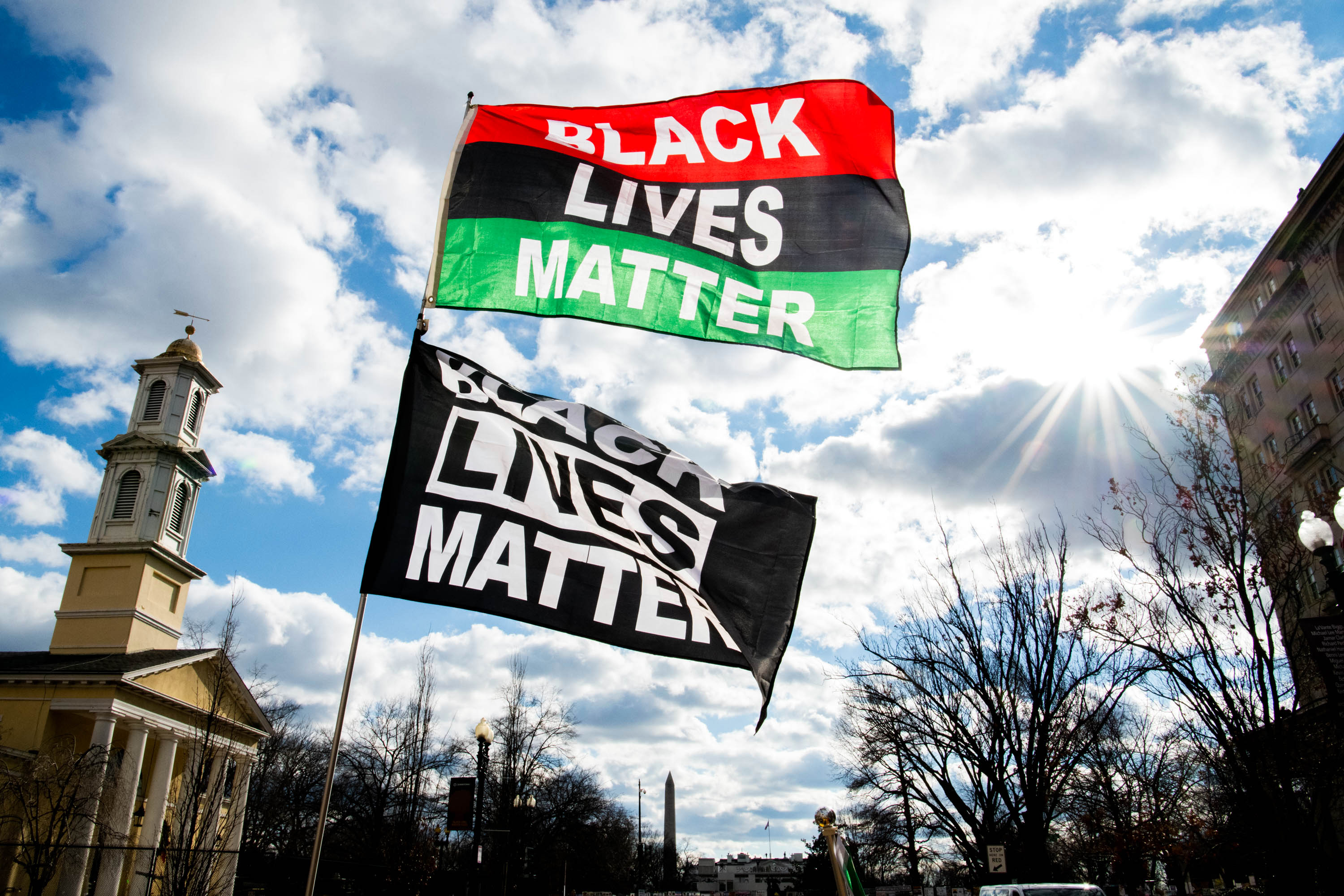 Jan 17, 2021; Washington, DC, USA; Black Lives Matter flags wave against the wind on Sunday, Jan. 17, 2021, at Black Lives Matter Plaza in Washington D.C. The nation's capital is on high-alert with heightened security against threats to President-elect Joe Biden’s inauguration following the deadly pro-Trump insurrection at the U.S. Capitol. Mandatory Credit: Brian Munoz-USA TODAY