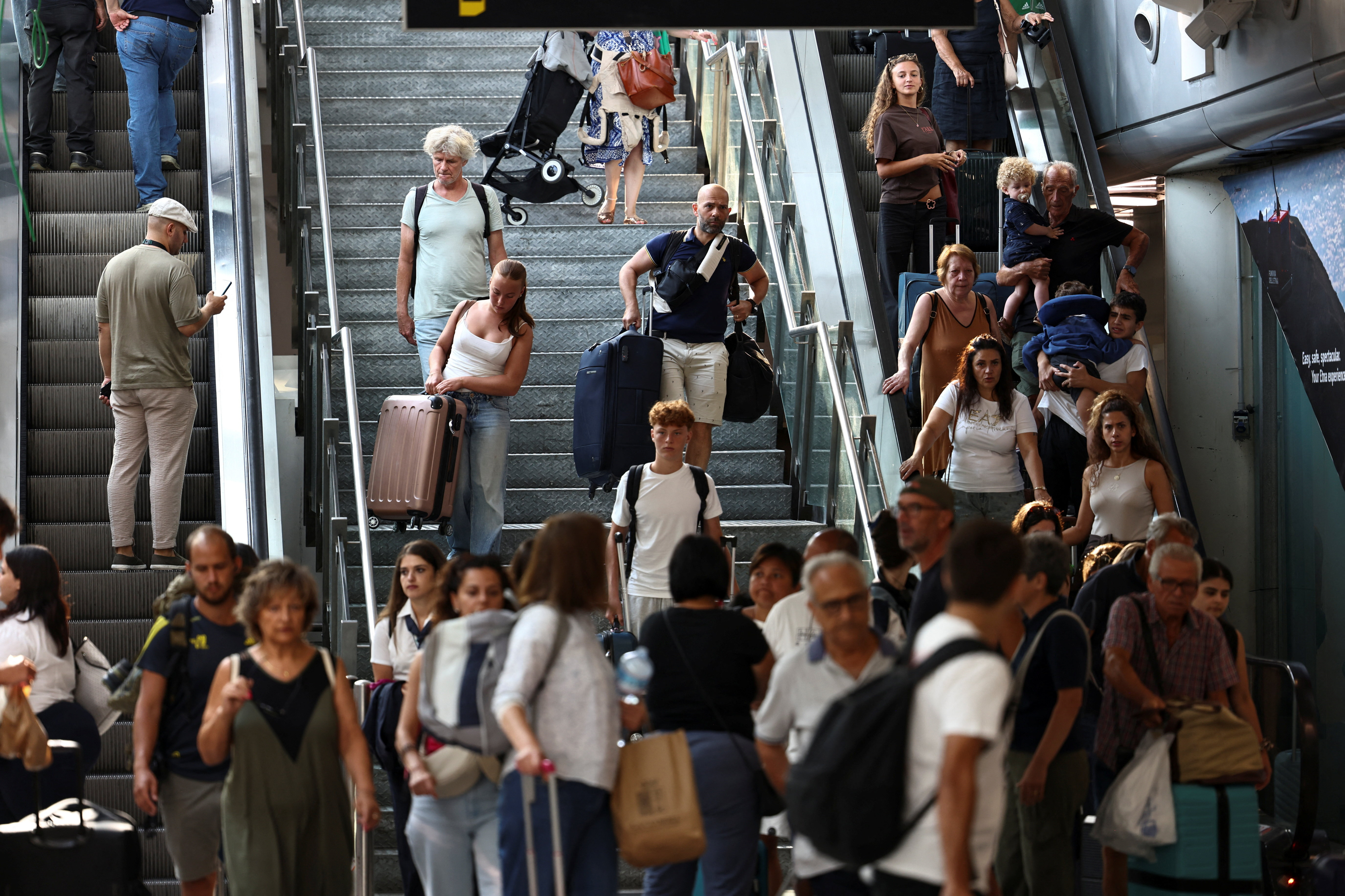 Passengers at the terminal at Vincenzo Bellini Catania Airport following its closure due to an ash cloud from Sicily’s Mount Etna eruption in Catania, Italy, August 14, 2026