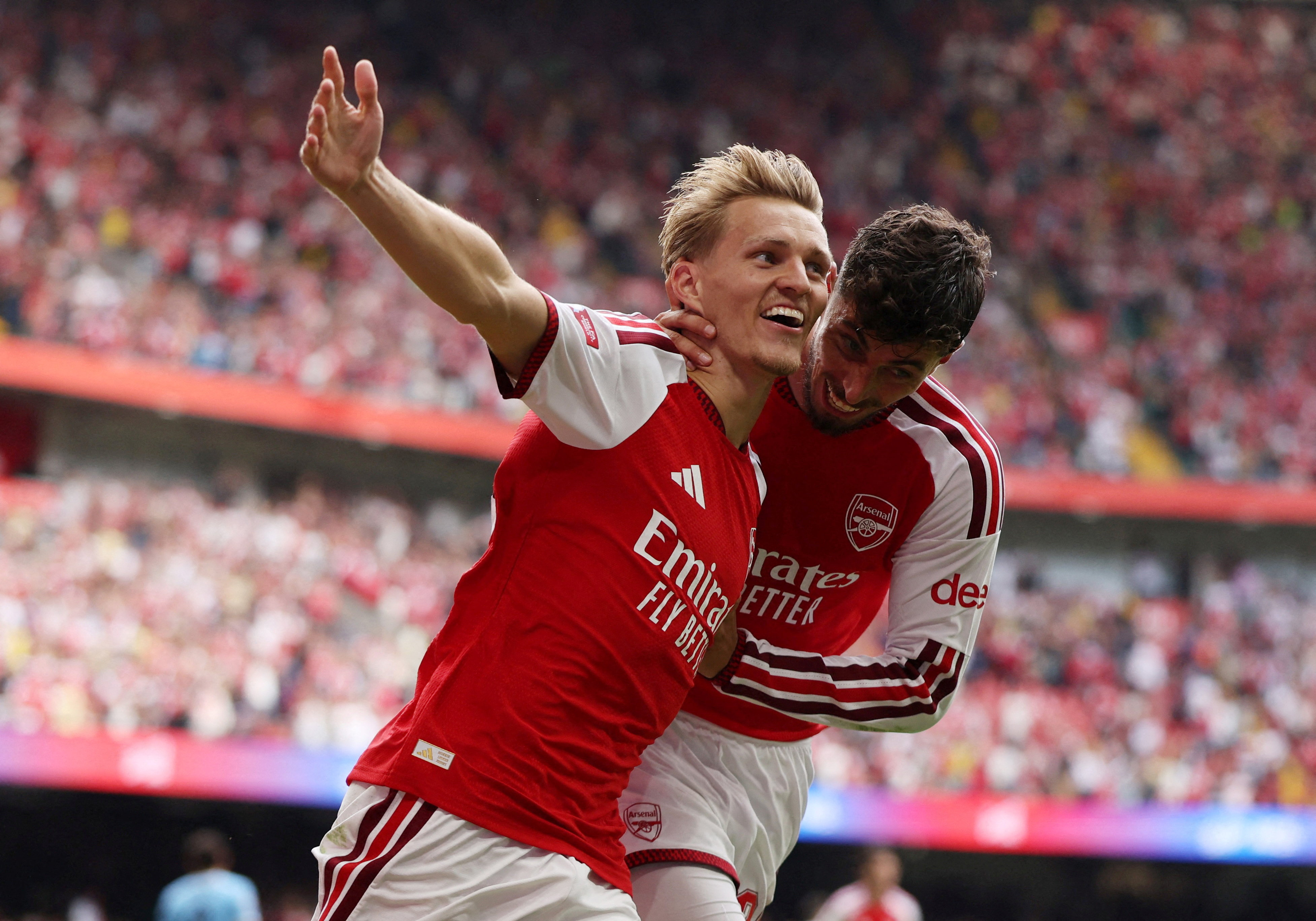 Soccer Football - FA Community Shield - Arsenal v Manchester City - Principality Stadium, Cardiff, Wales, Britain - August 16, 2026 Arsenal's Martin Odegaard celebrates scoring their third goal with Kai Havertz REUTERS/Chris Radburn TPX IMAGES OF THE DAY
