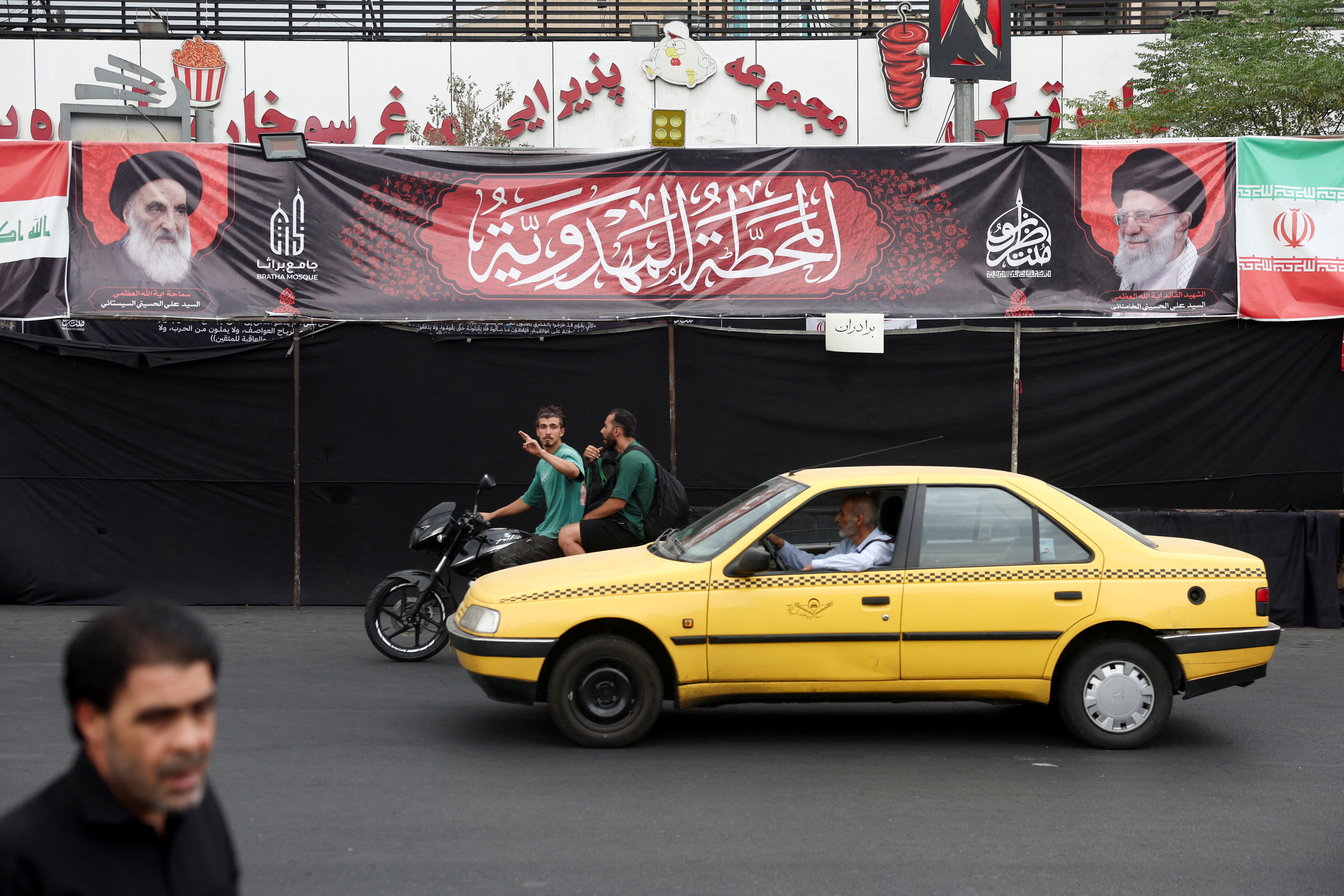 A banner shows pictures of Iraq's top Shi'ite cleric, Grand Ayatollah Ali al-Sistani and Iran's late Supreme Leader Ayatollah Ali Khamenei, on a street in Tehran, Iran, August 3, 2026. Majid Asgaripour/WANA (West Asia News Agency) via REUTERS ATTENTION EDITORS - THIS PICTURE WAS PROVIDED BY A THIRD PARTY. ISRAEL OUT. NO COMMERCIAL OR EDITORIAL SALES IN ISRAEL. NO ACCESS FOR ISRAELI MEDIA. NO USE BBC PERSIAN. NO USE VOA PERSIAN. NO USE MANOTO. NO USE IRAN INTERNATIONAL. NO USE RADIO FARDA. DIGITAL: NO USE BBC PERSIAN. NO USE VOA PERSIAN. NO USE MANOTO. NO USE IRAN INTERNATIONAL. NO USE RADIO FARDA.