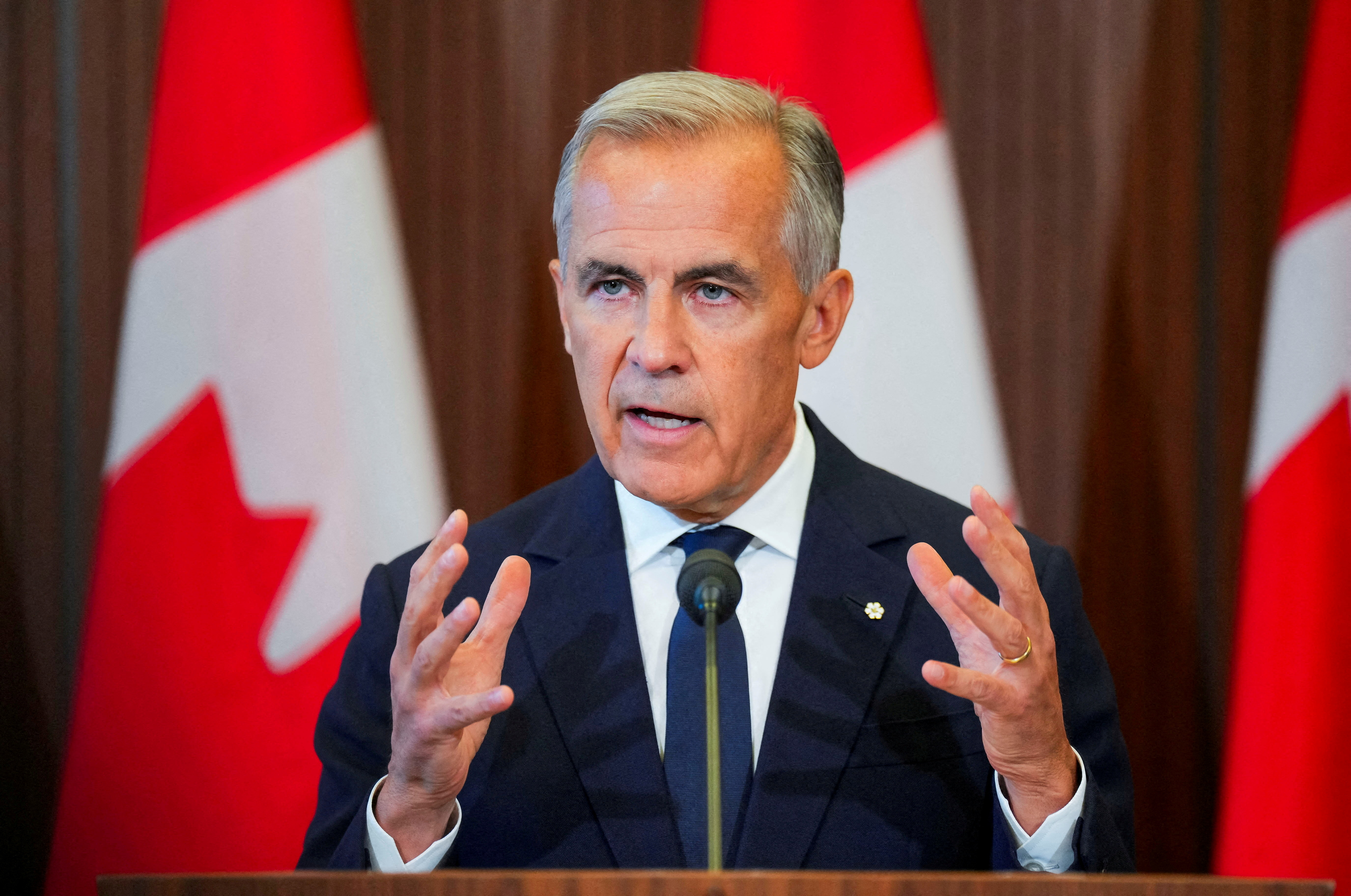 FILE PHOTO: Canada’s Prime Minister Mark Carney speaks with the news media after he suspended trade negotiations with the United States, in Ottawa, Ontario, Canada August 22, 2026. REUTERS/Chris Tanouye/File Photo