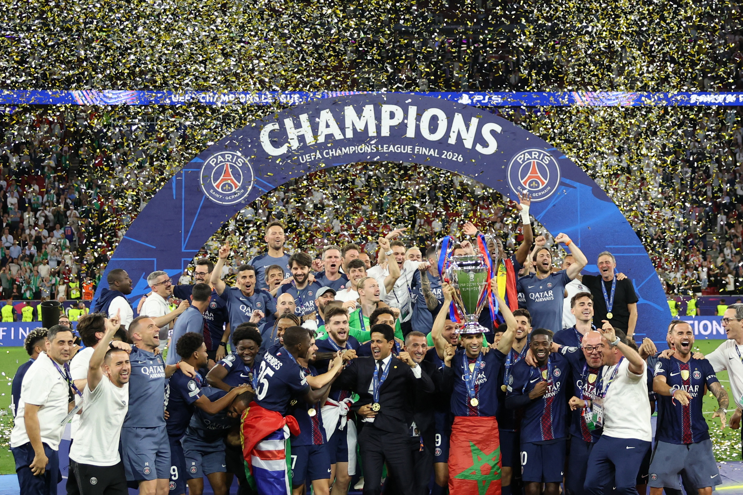 Soccer Football - UEFA Champions League - Final - Paris St Germain v Arsenal - Puskas Arena, Budapest, Hungary - May 30, 2026 Paris St Germain's Achraf Hakimi lifts the trophy as he celebrates with teammates after winning the UEFA Champions League REUTERS/Andrew Boyers