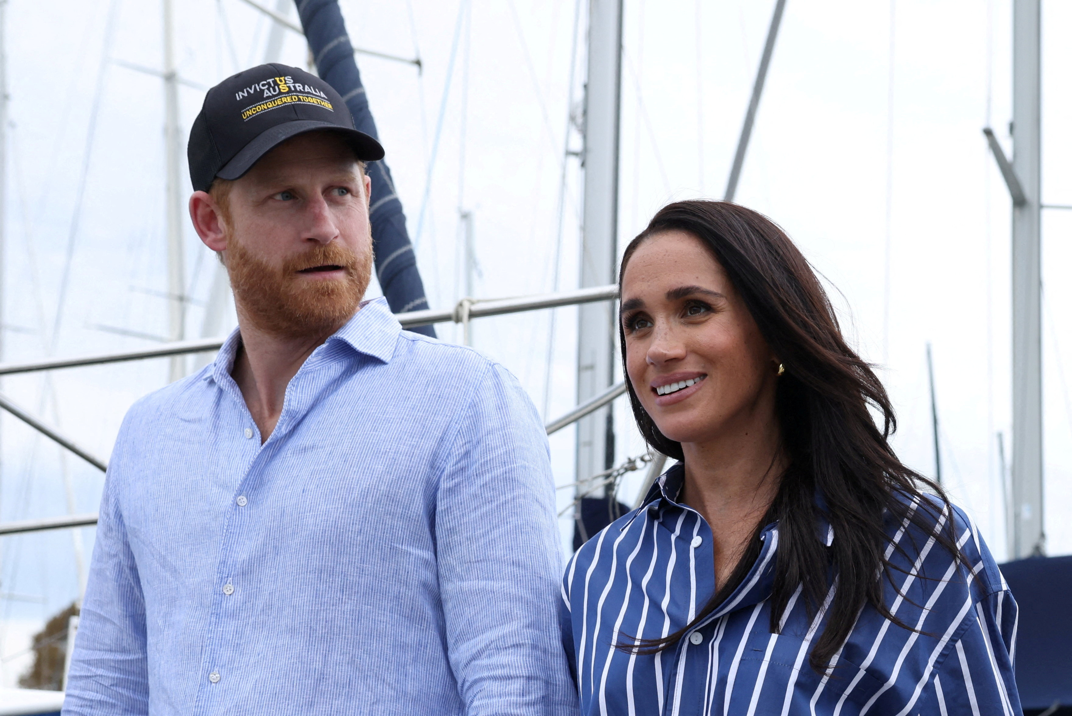 FILE PHOTO: Britain's Prince Harry and Meghan, the Duke and Duchess of Sussex, disembark after sailing on Sydney Harbour with veterans from the Invictus Australia community, in Sydney, Australia, April 17, 2026. REUTERS/Hollie Adams/File Photo