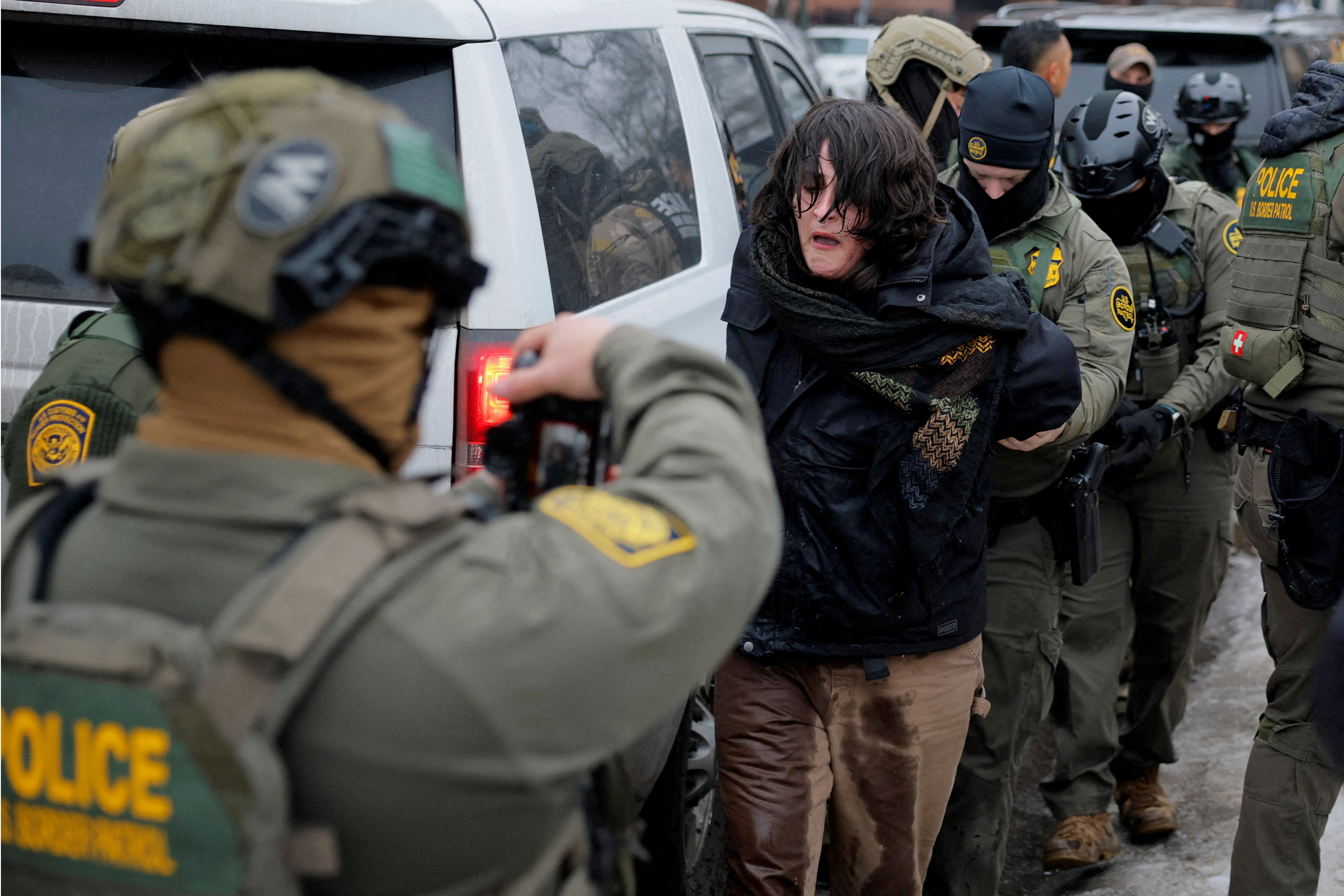 FILE PHOTO: U.S. Border Patrol Agents working with Border Patrol commander Greg Bovino detain a protestor, a day after the fatal shooting of Renee Nicole Good by a U.S. Immigration and Customs Enforcement (ICE) agent, in Minneapolis, Minnesota, U.S., January 8, 2026. REUTERS/Brian Snyder/File Photo